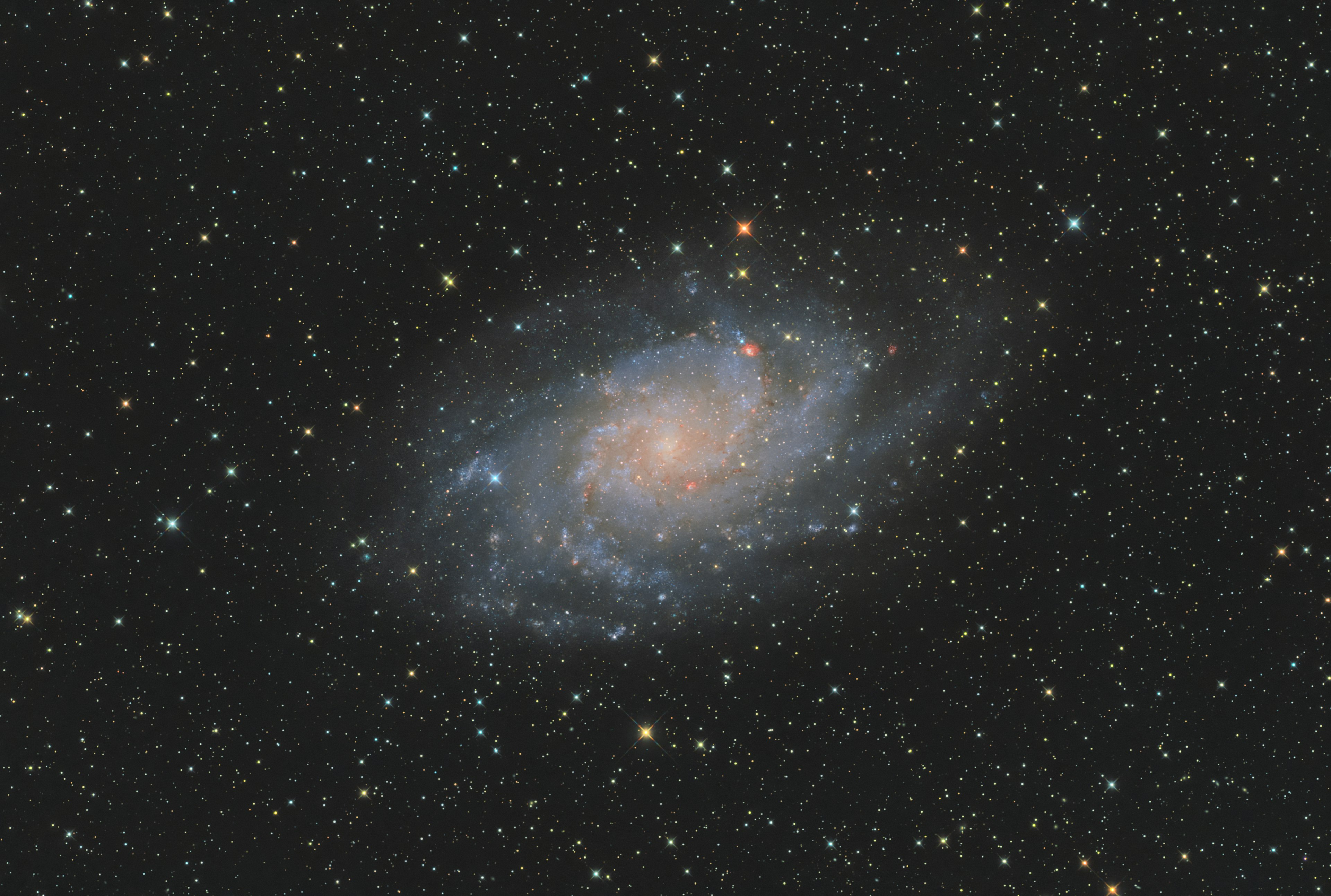 A beautiful spiral galaxy floating among stars in the night sky