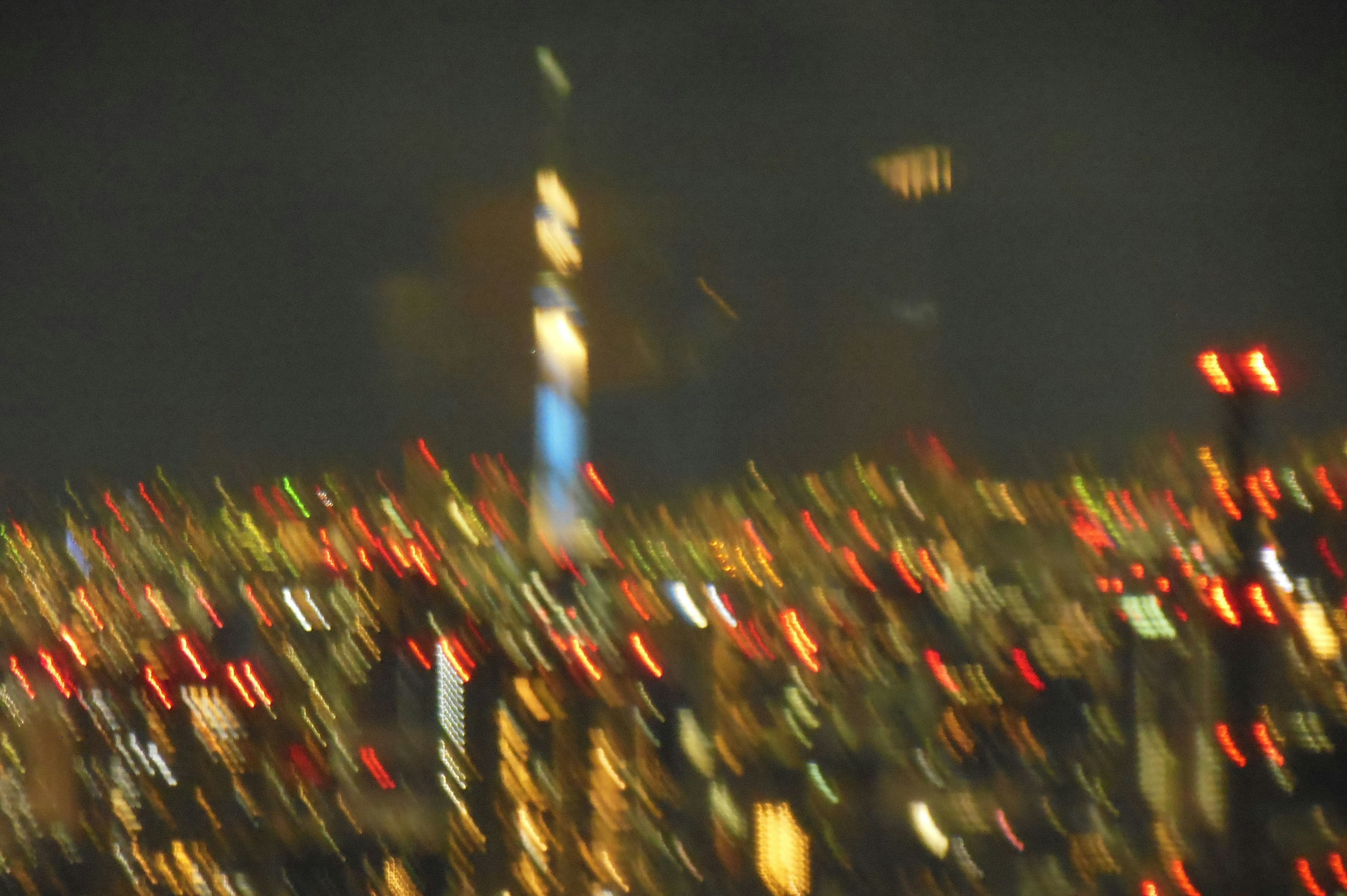 Blurry night view with Tokyo Skytree visible