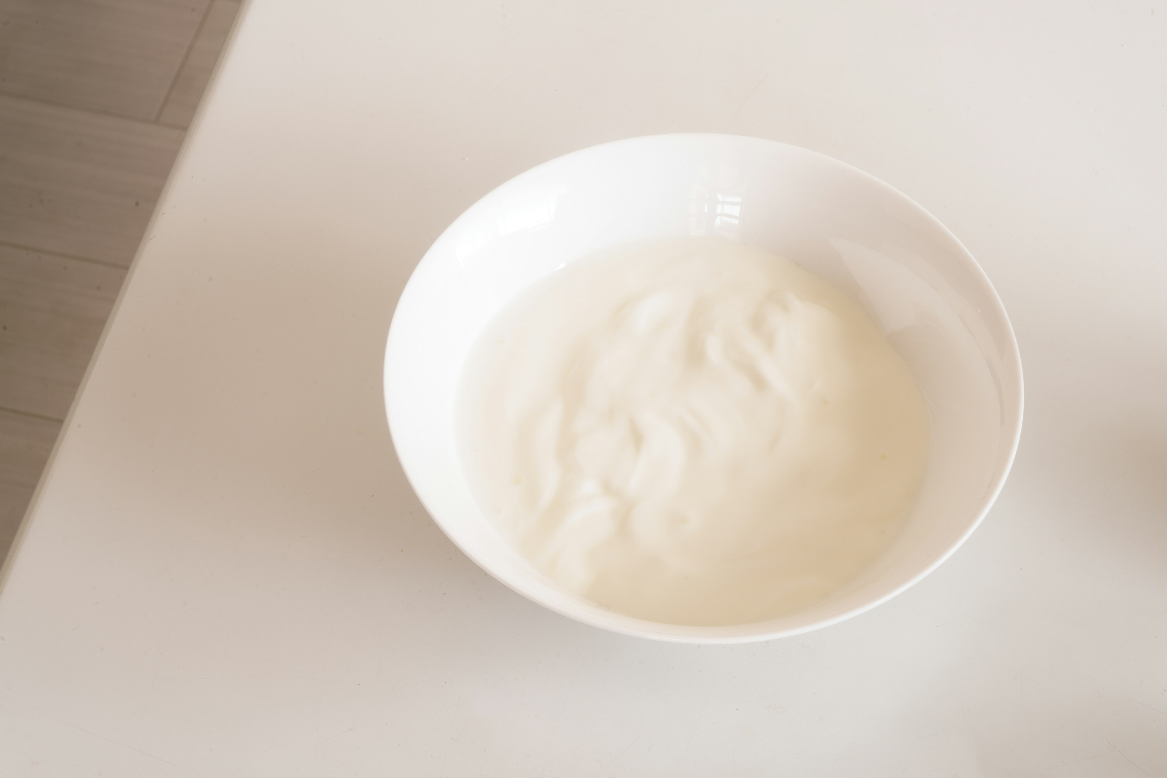 Creamy substance in a white bowl