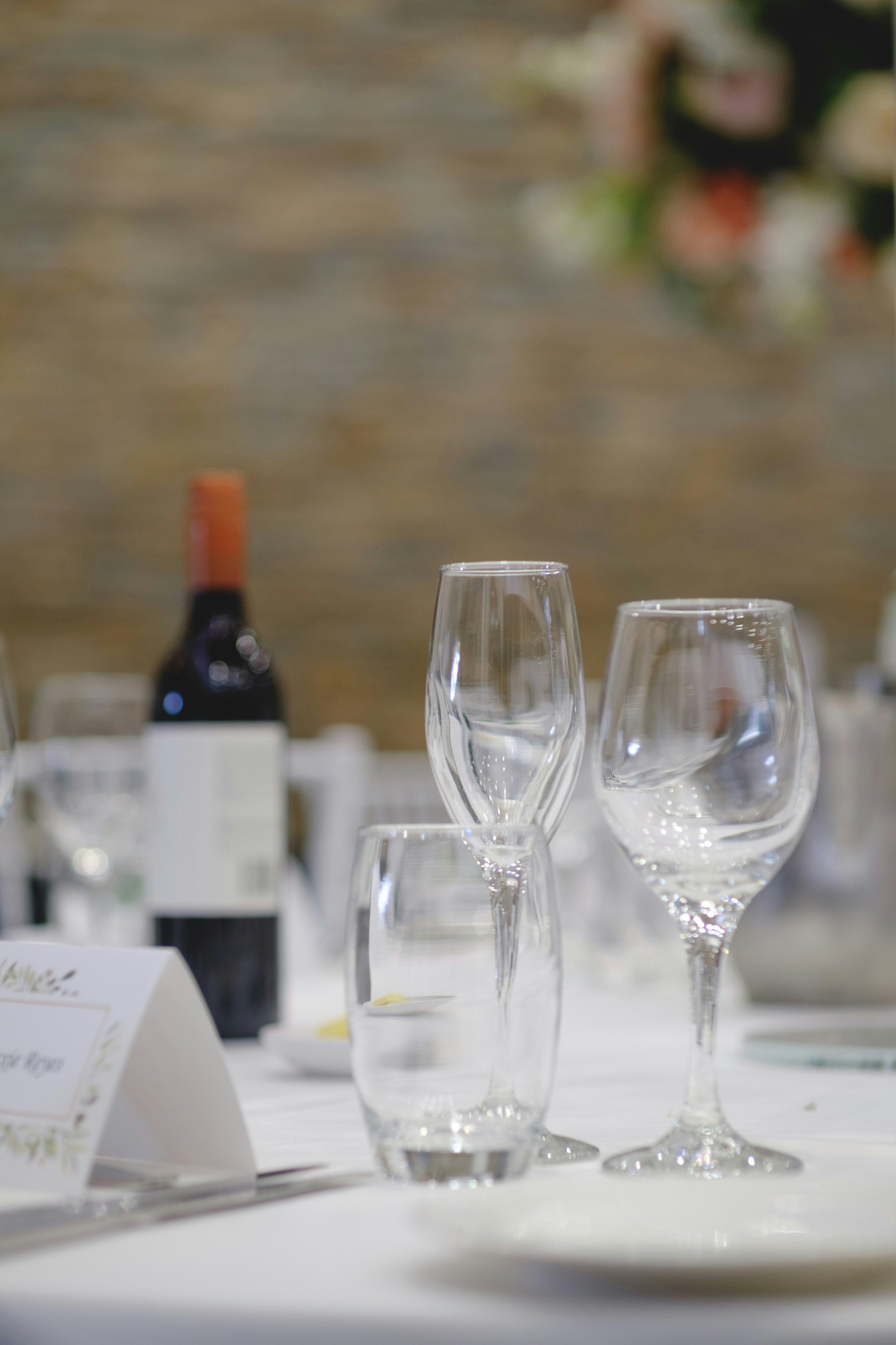 Elegant table setting featuring wine glasses and a water glass