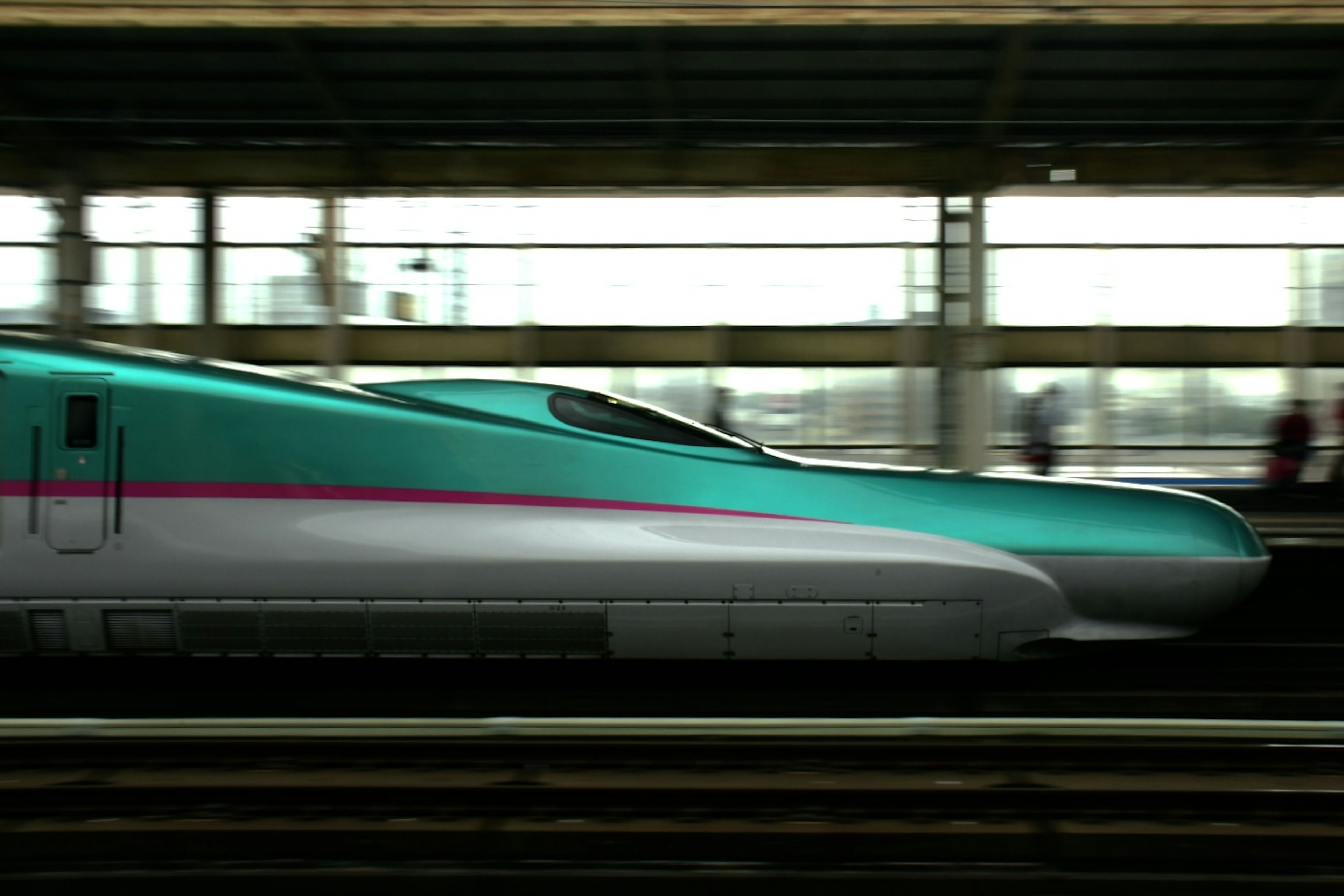 Shinkansen train with sleek design and distinctive colors