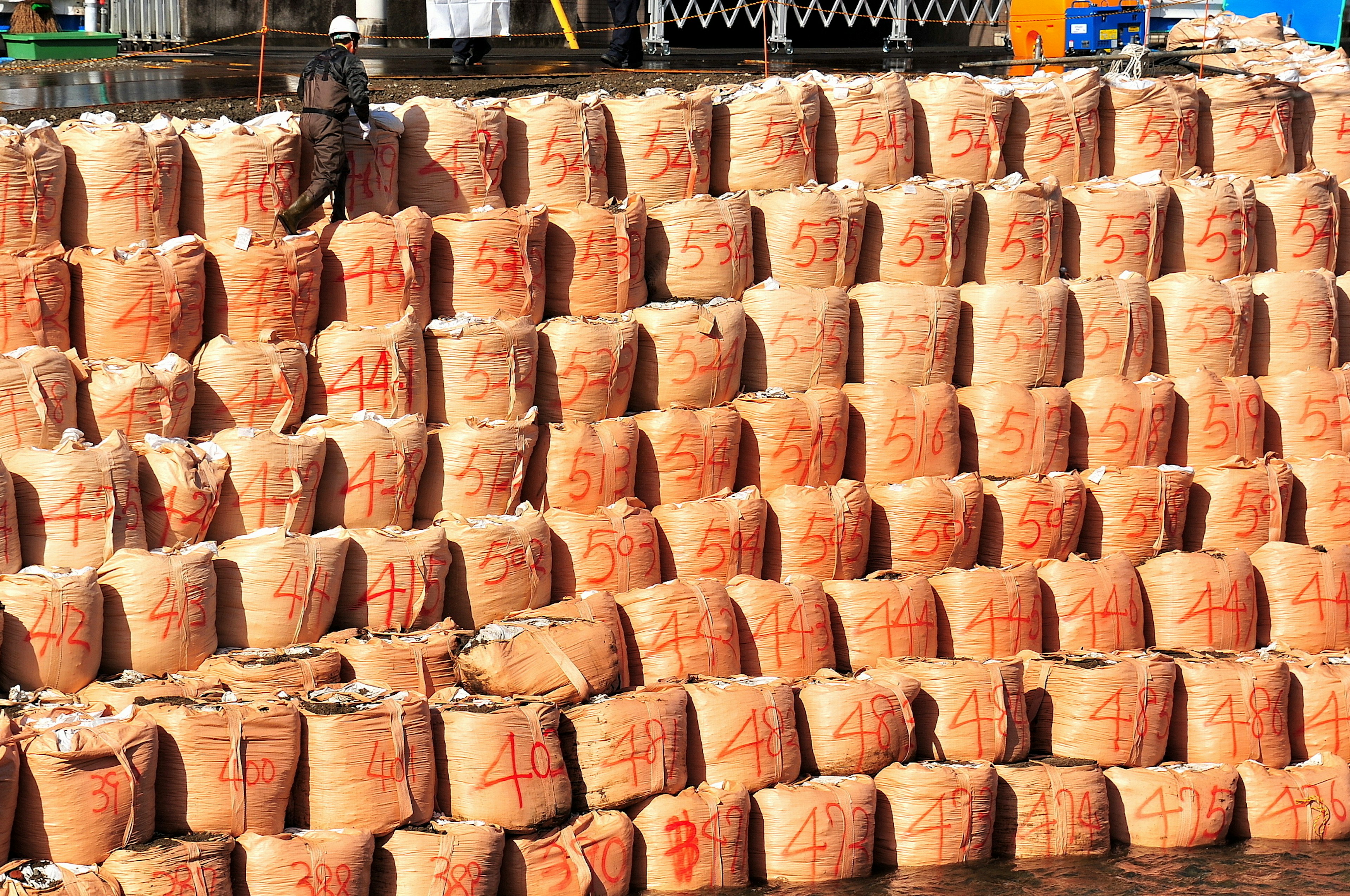 Stacked brown bags in a warehouse setting