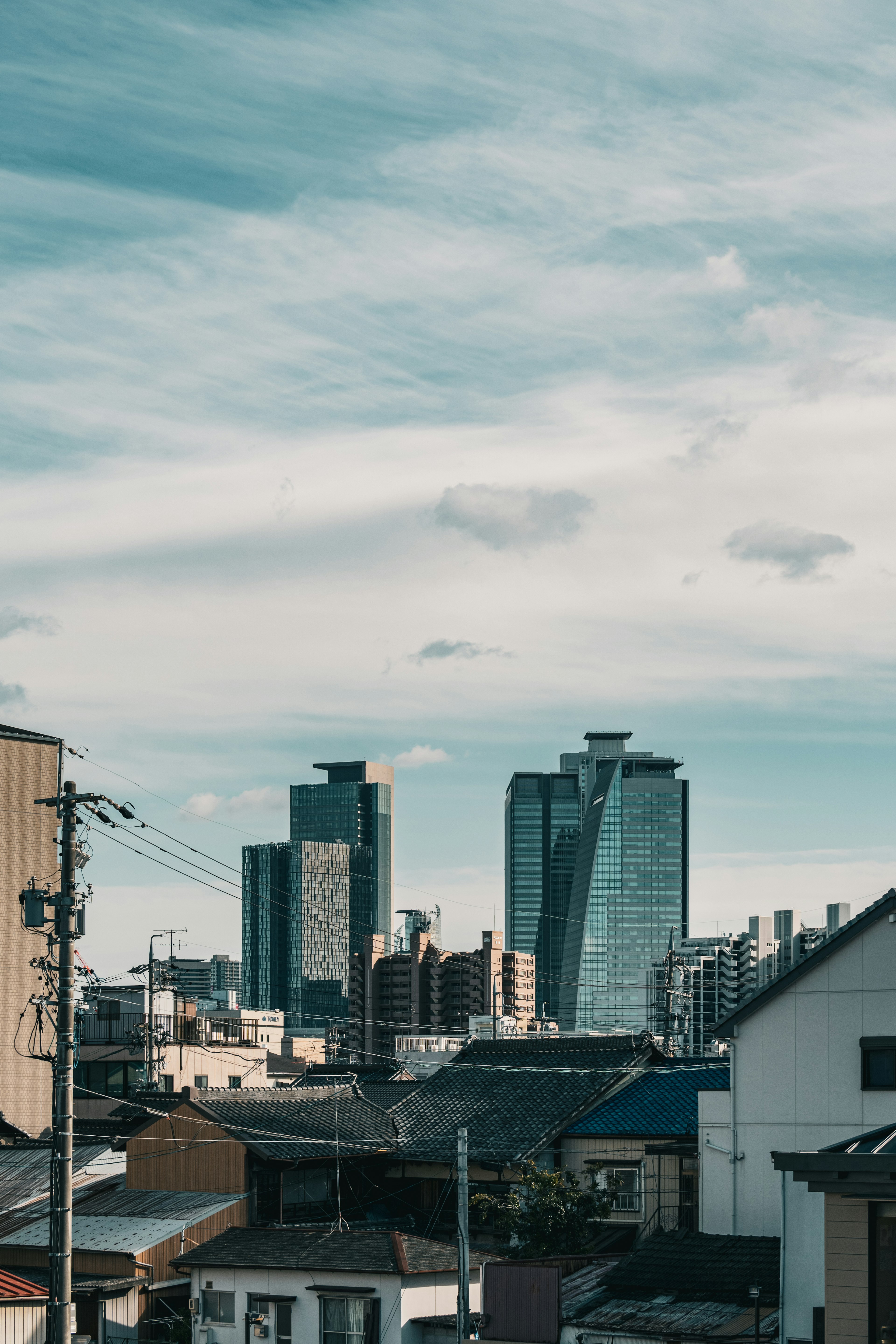 Urban landscape featuring tall buildings against a cloudy sky