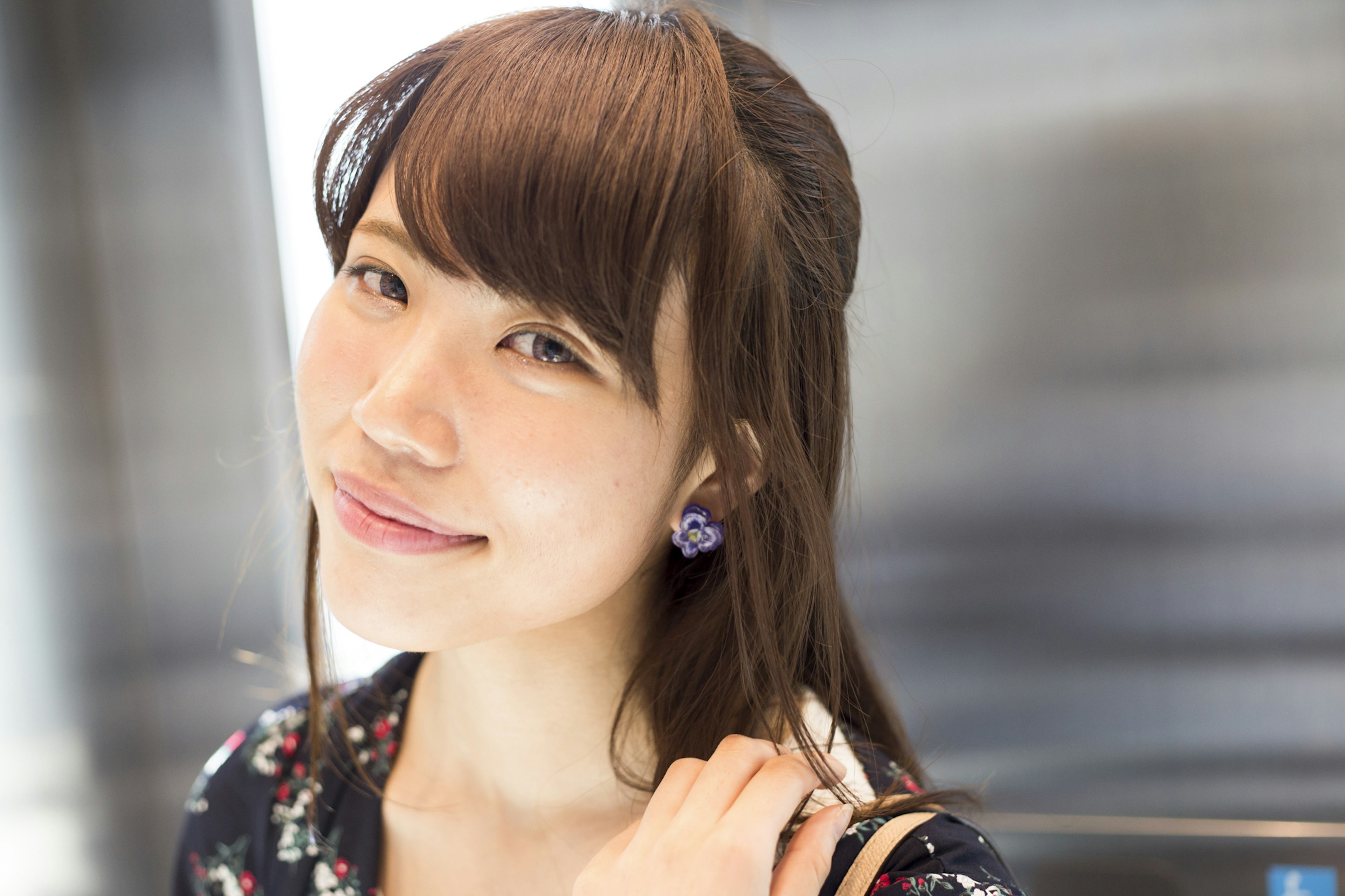 A woman with a bright smile and shoulder-length hair