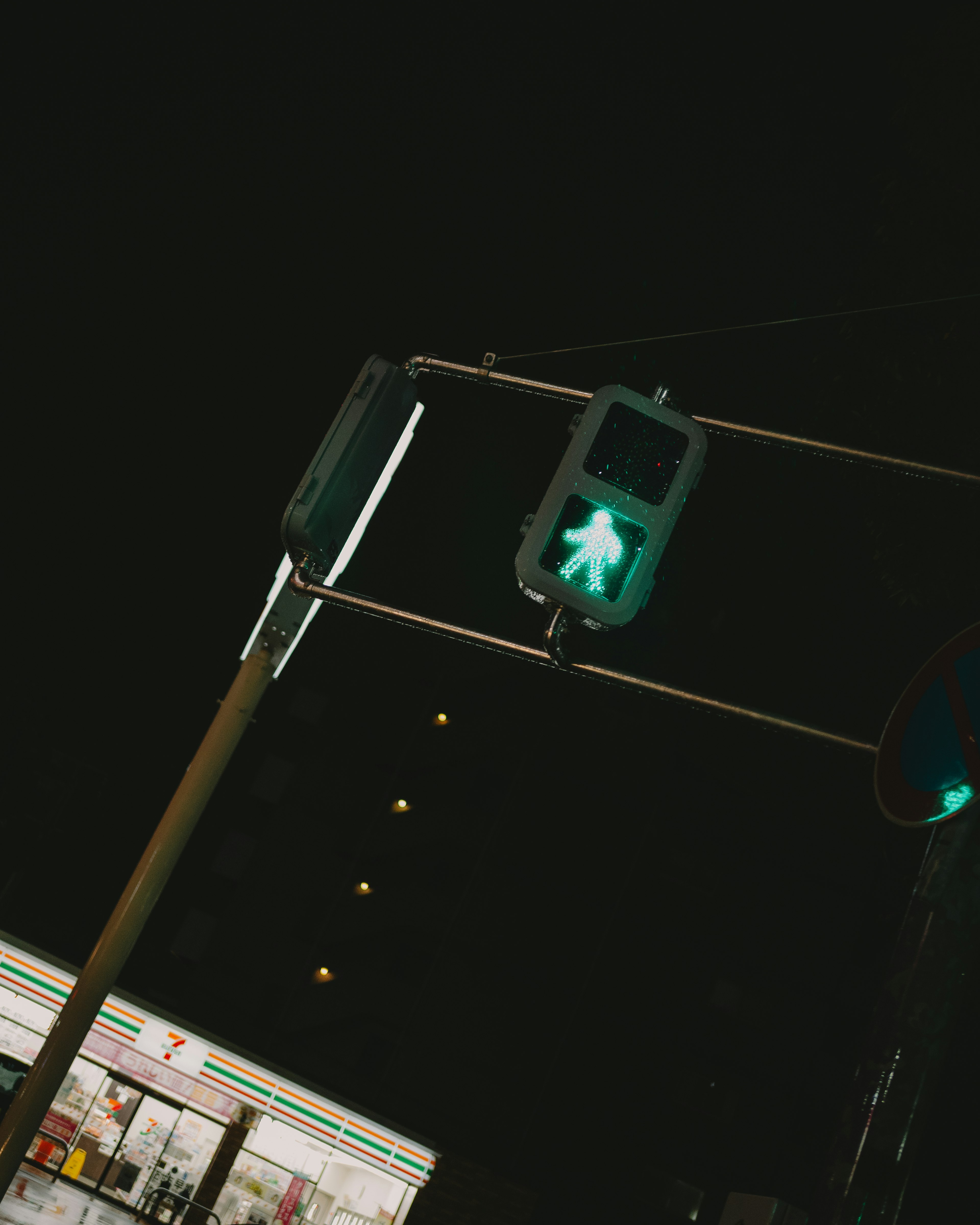 Green pedestrian signal at night