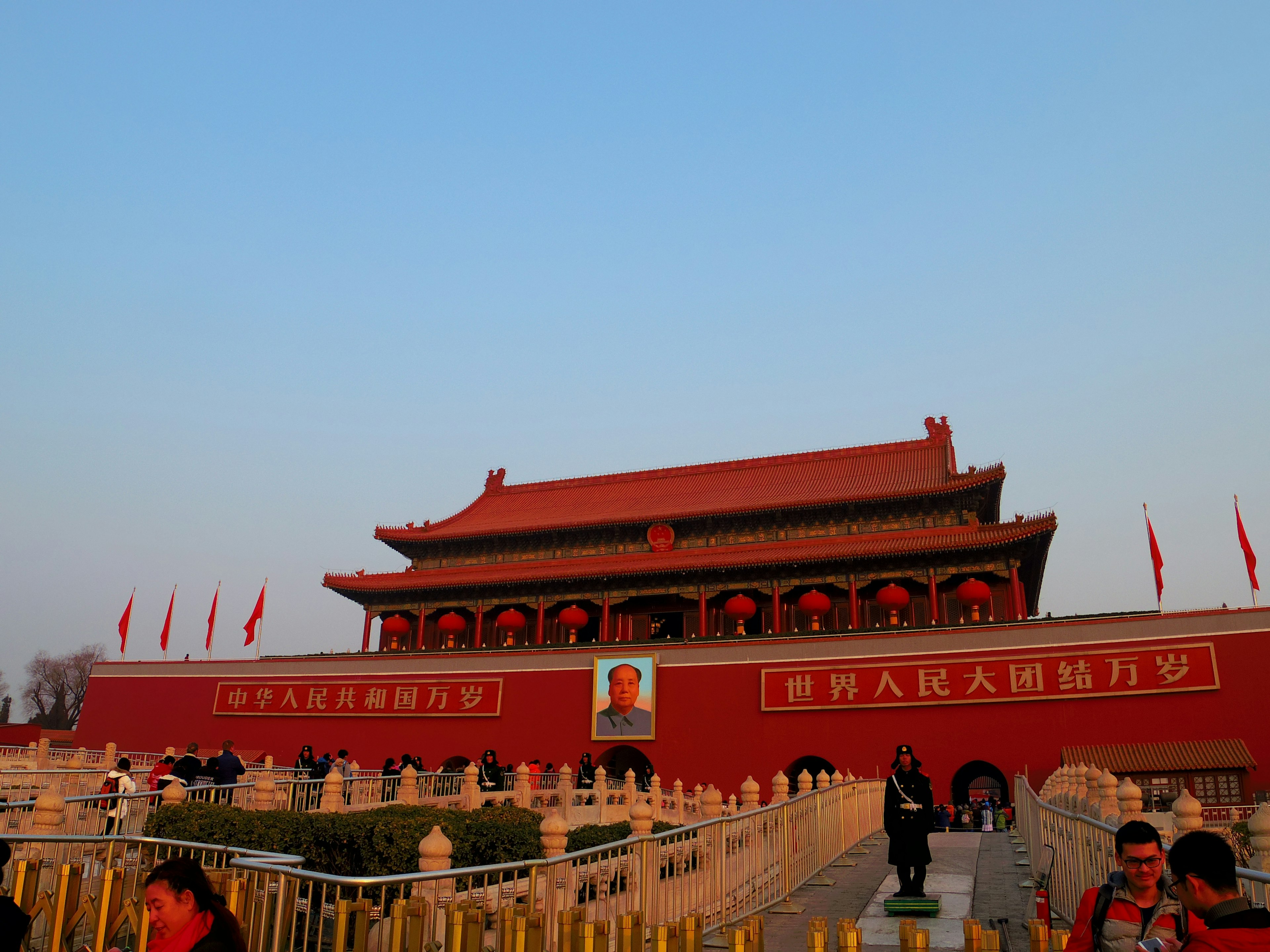 Tiananmen Square with red building and blue sky