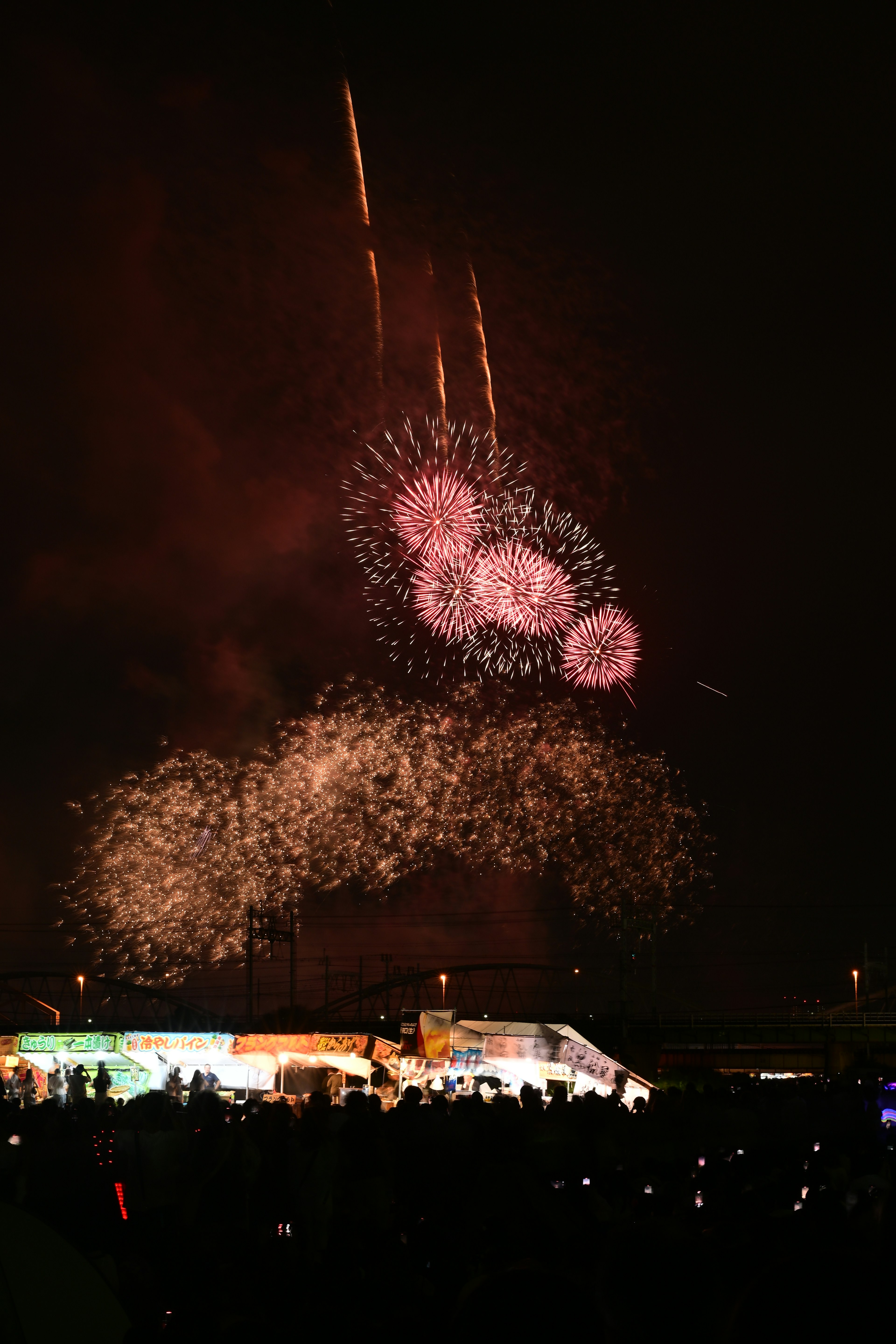 Vibrant fireworks display lighting up the night sky with colorful bursts and shapes