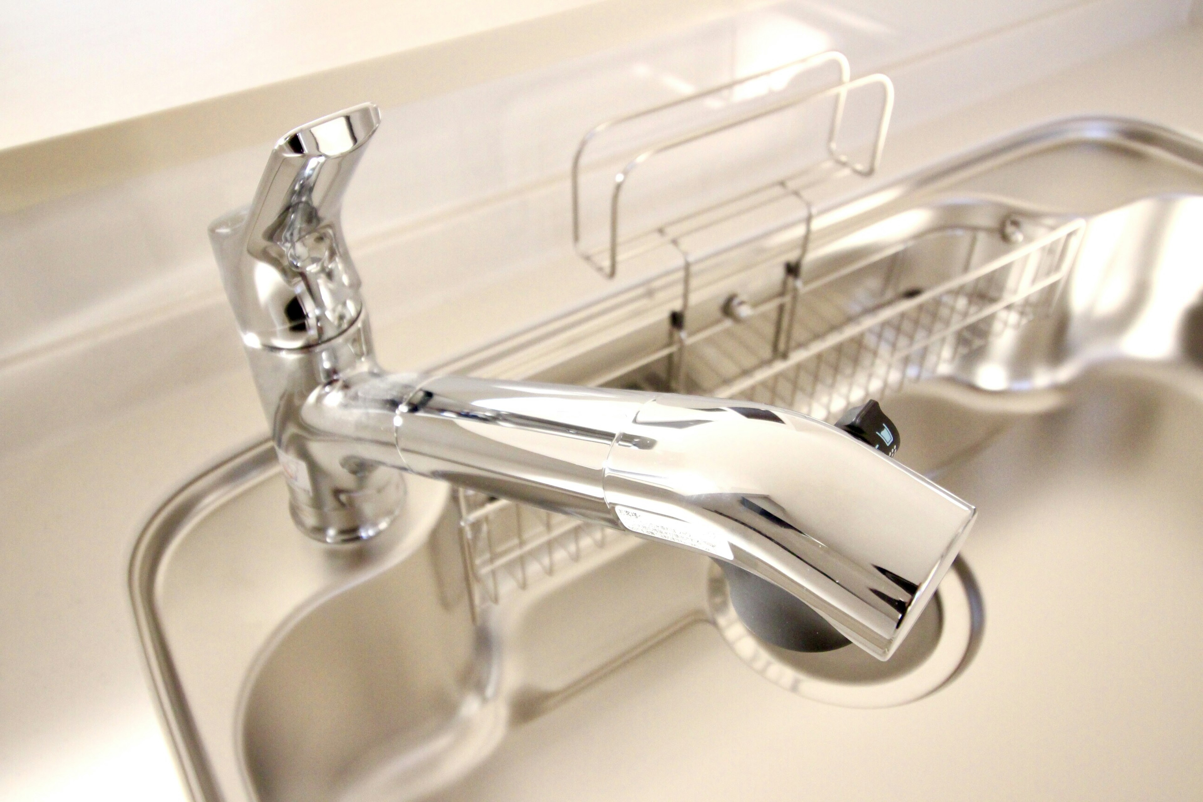 Stylish chrome faucet mounted on a kitchen sink