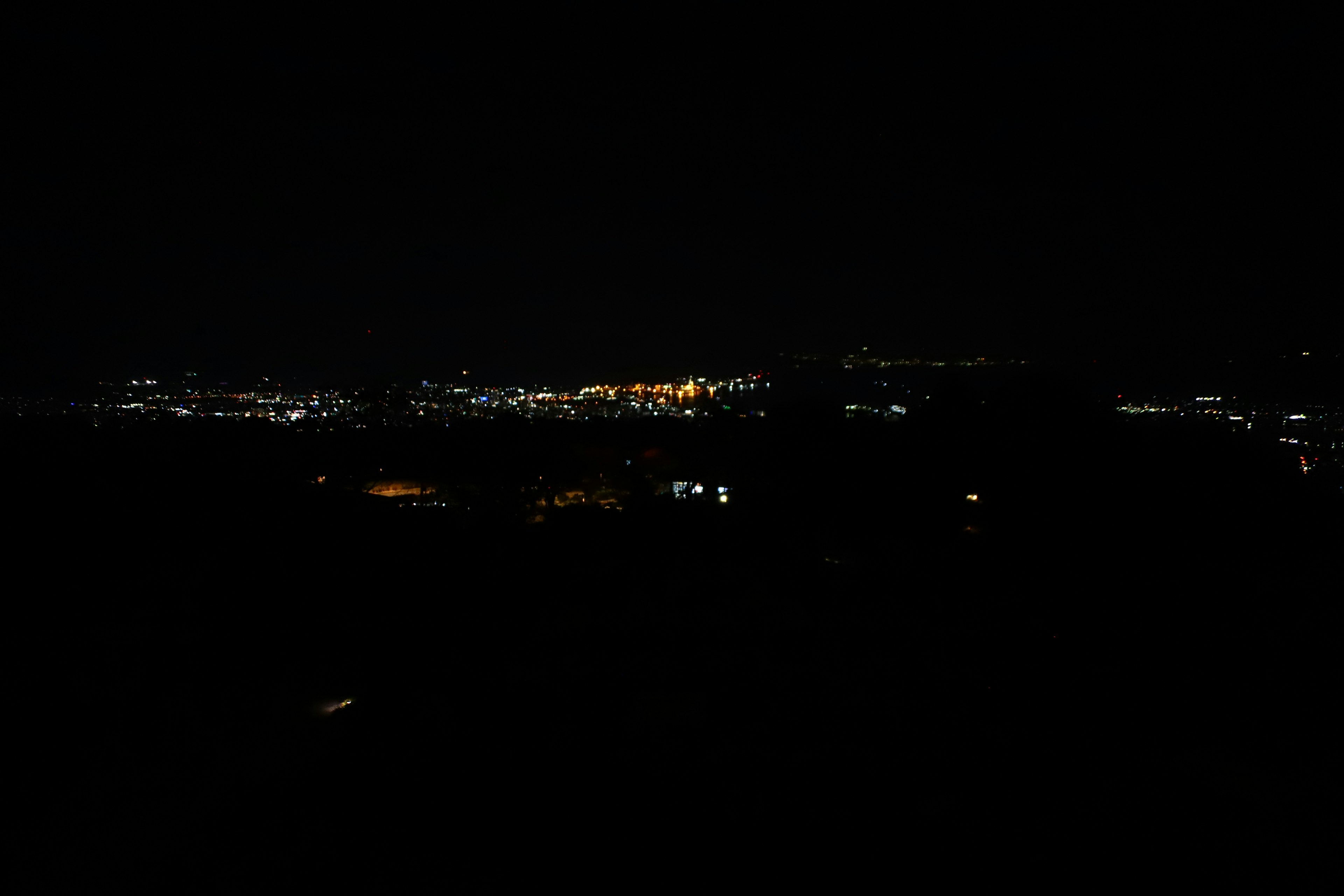 City skyline at night with sparkling lights