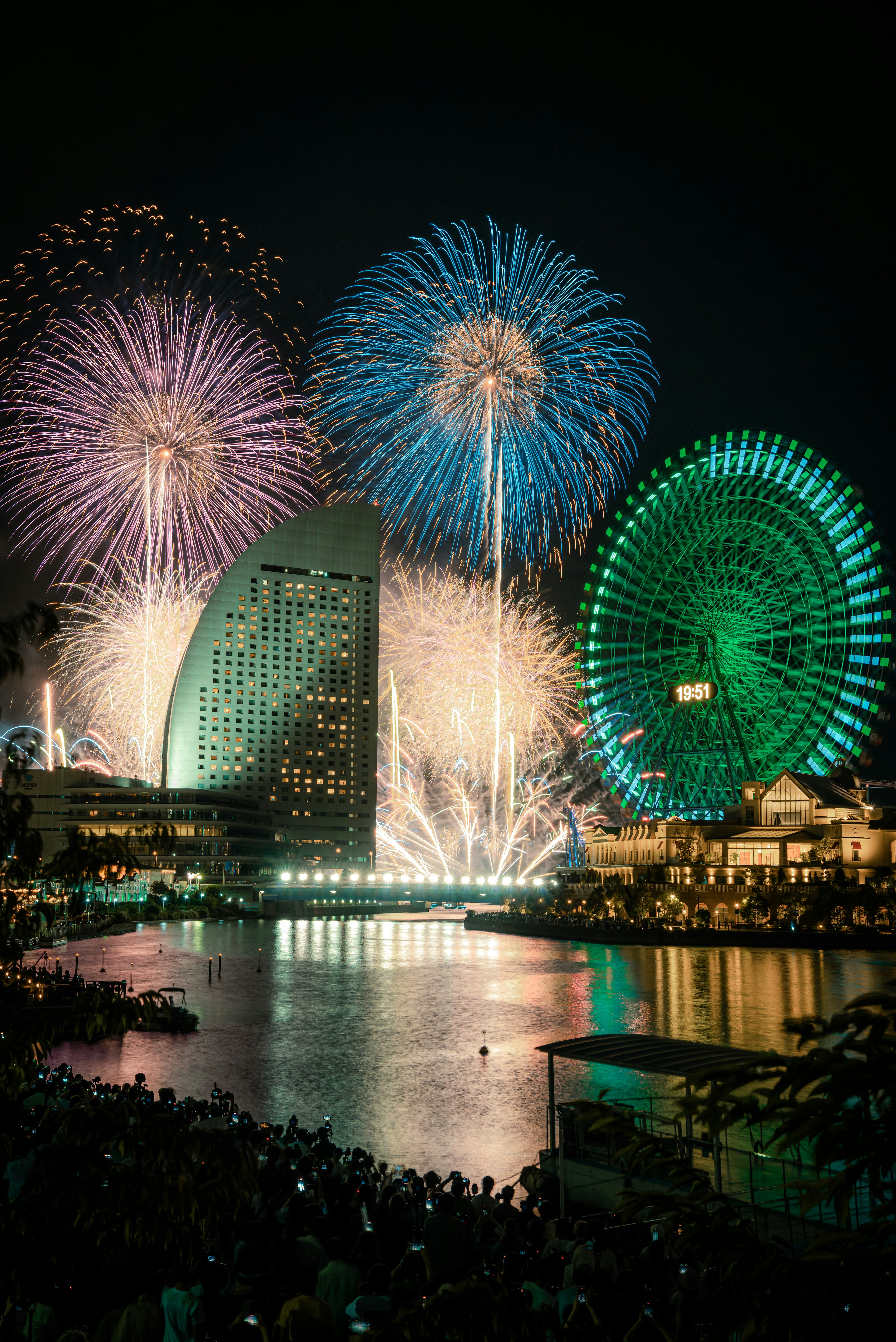 Spectacular fireworks display over Yokohama with a giant Ferris wheel