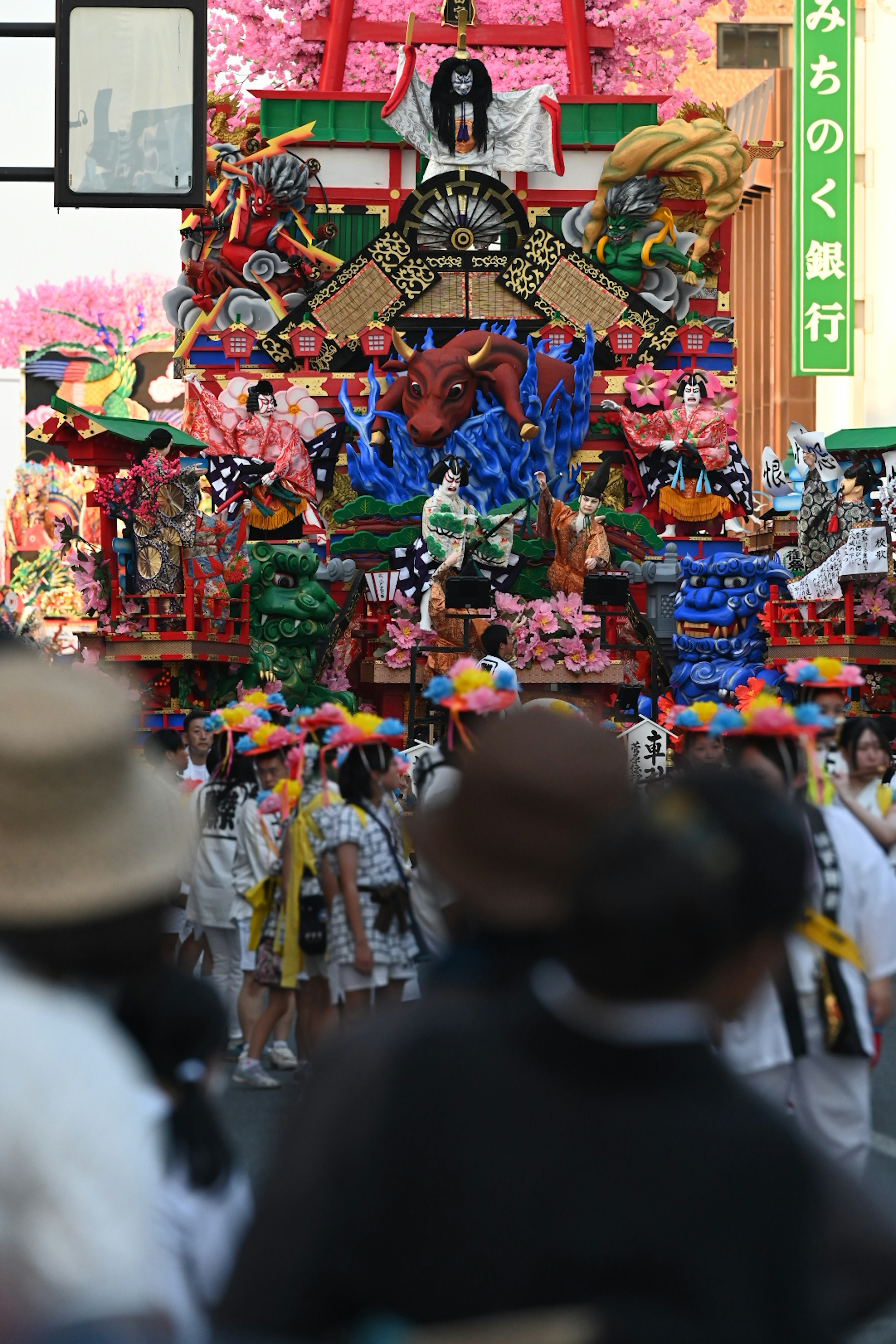 Vibrant festival scene with decorative float and participants in colorful costumes