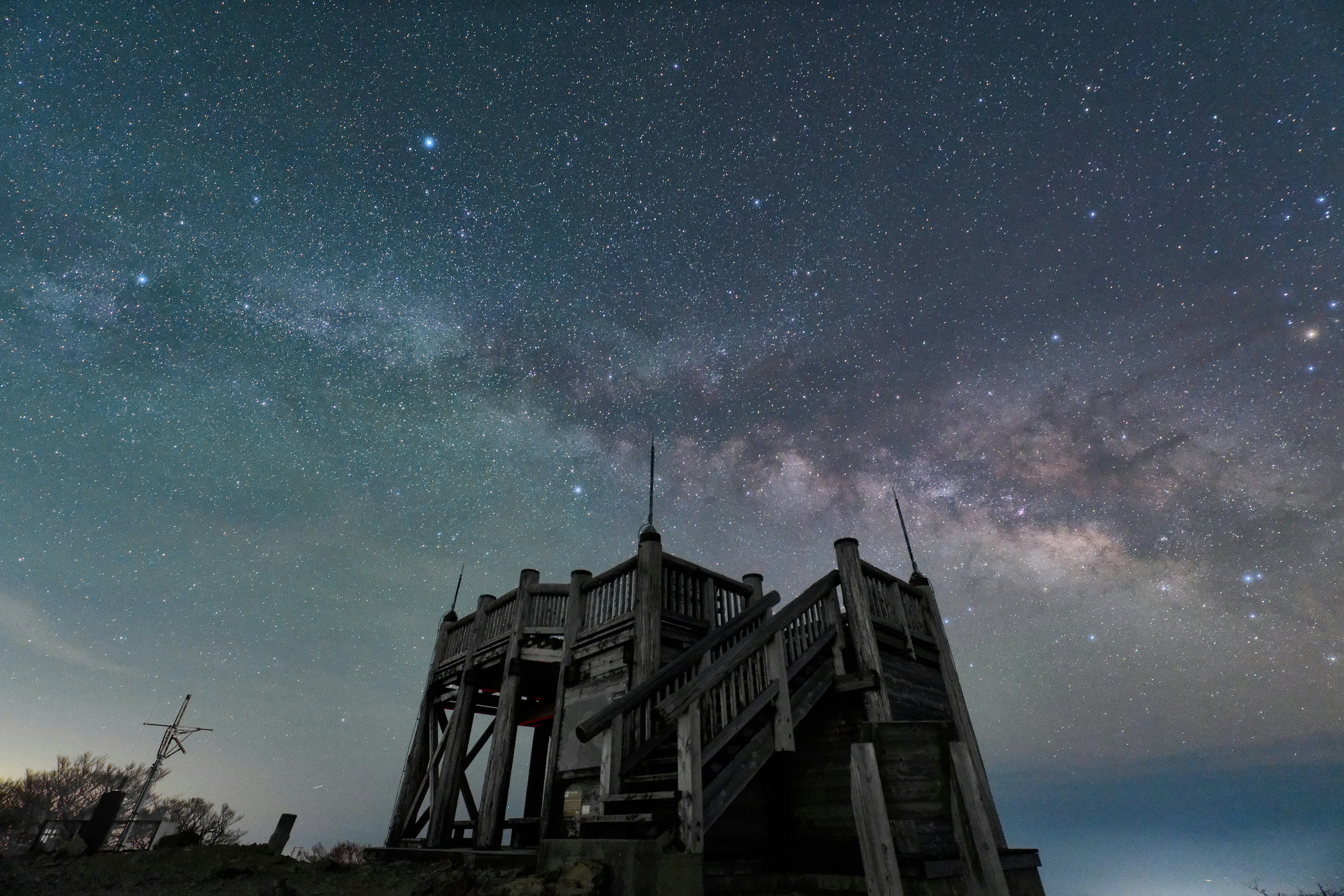 Old building under a starry sky with a stunning view of the Milky Way