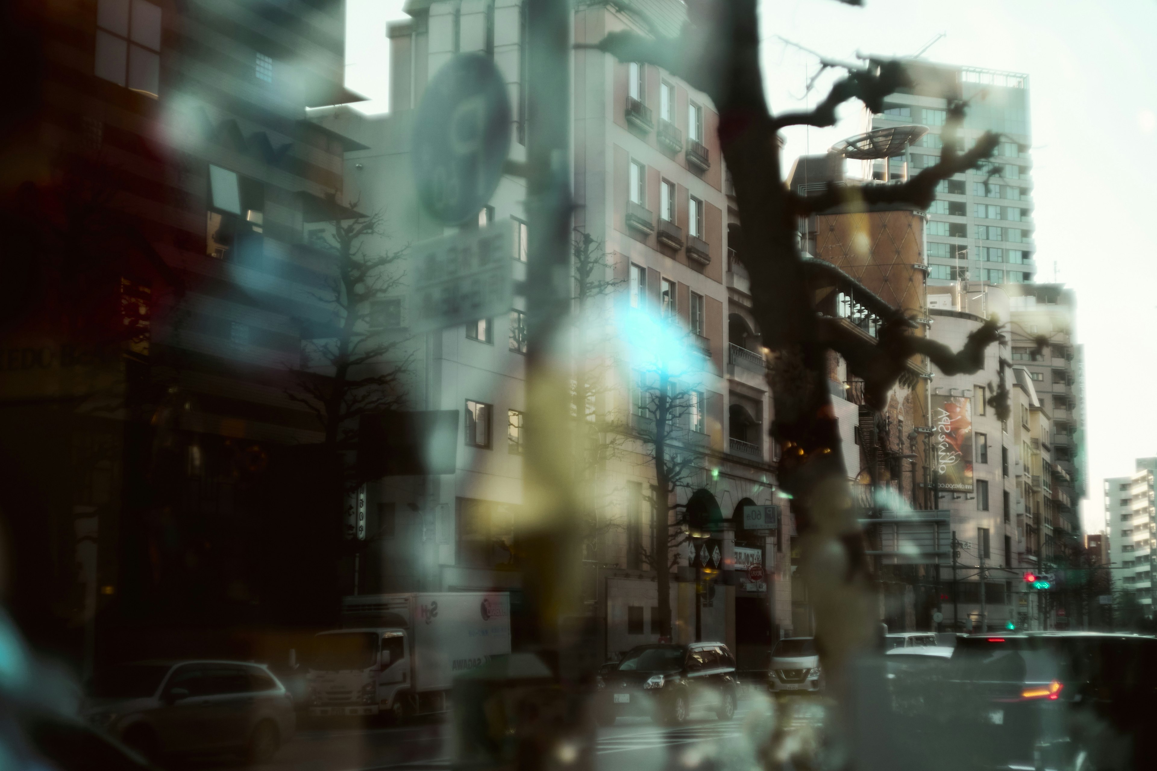 Reflection of a cityscape in a glass window