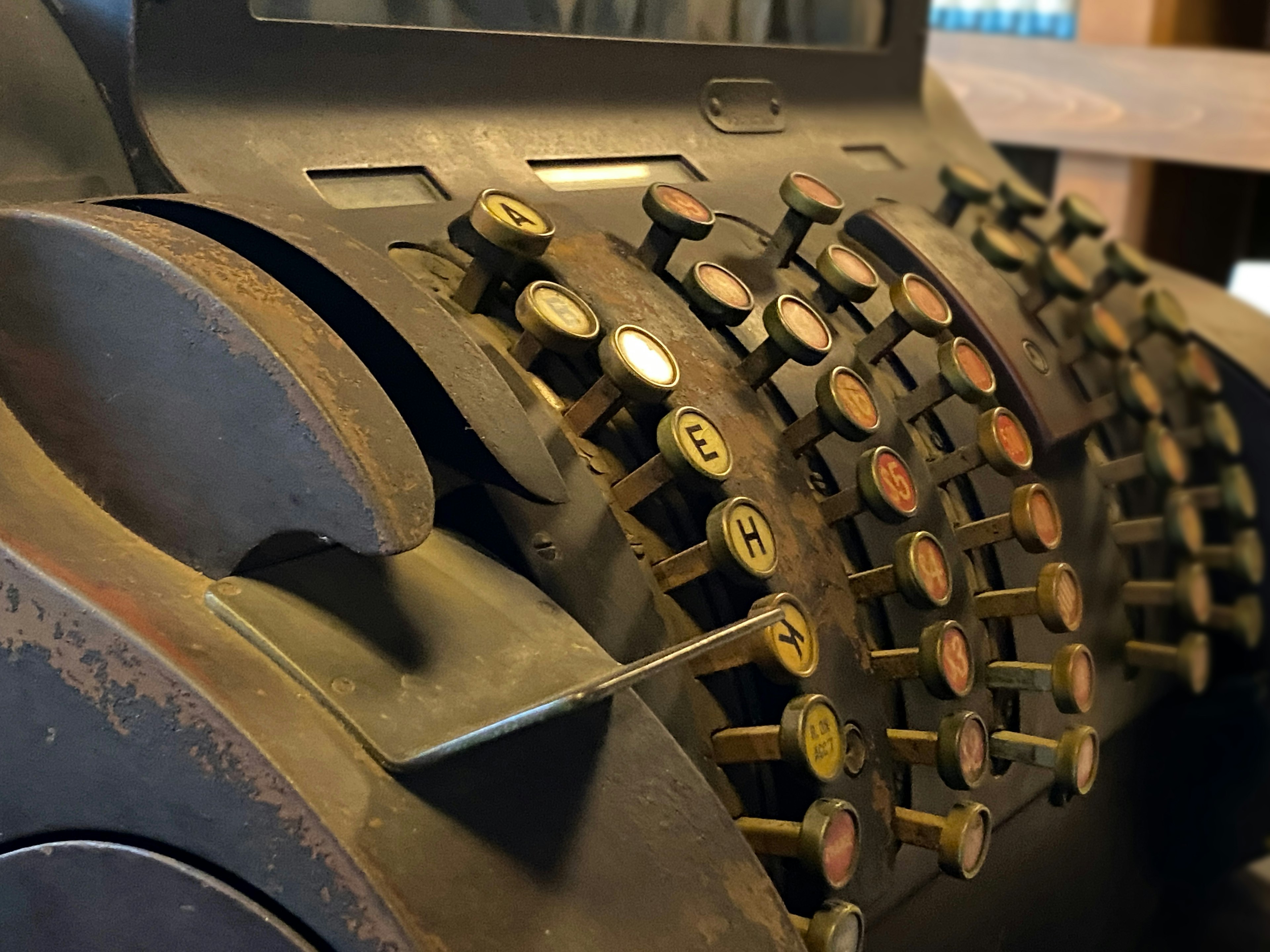 Close-up of an old typewriter featuring metallic keys