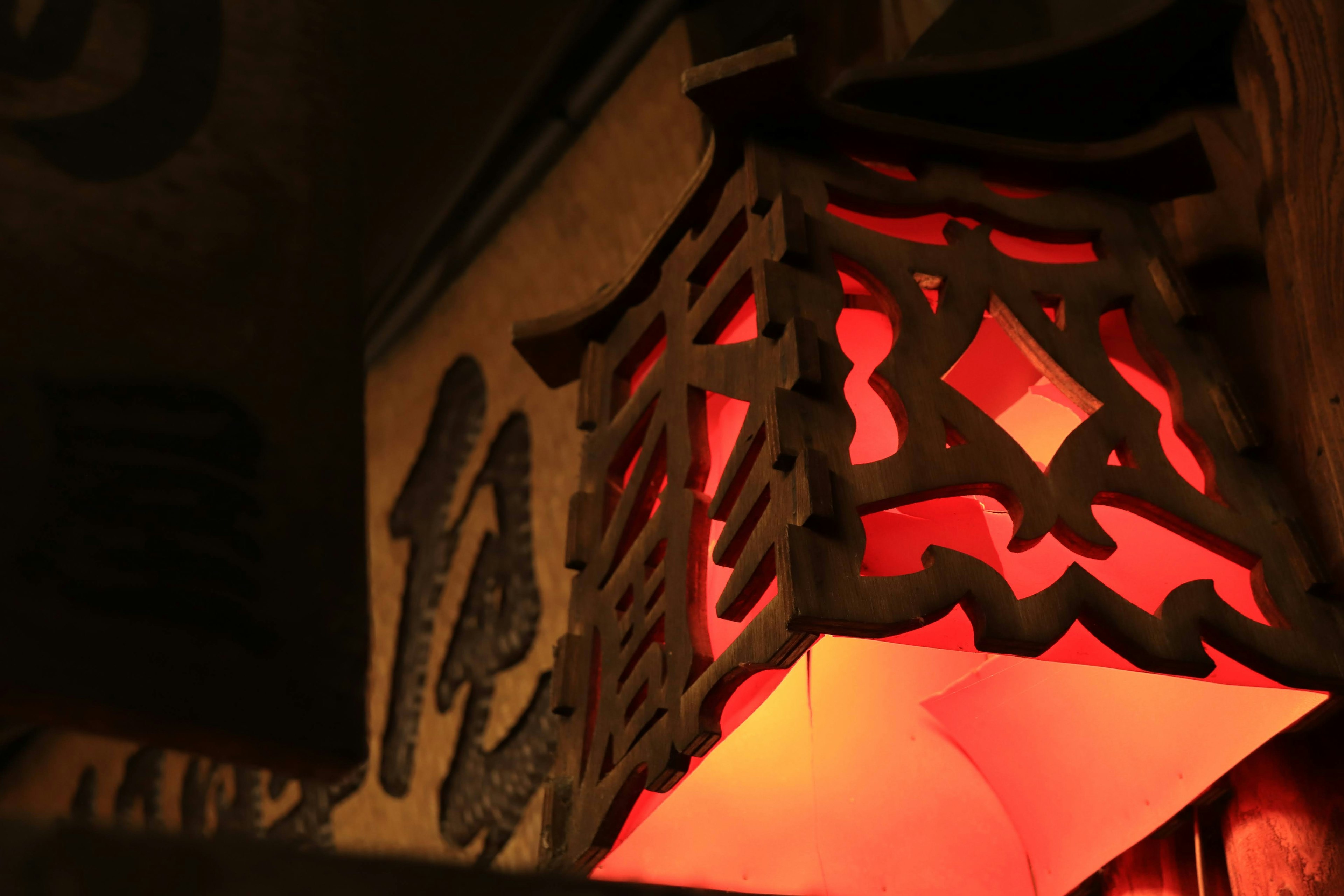 Close-up of a decorative lamp emitting red light