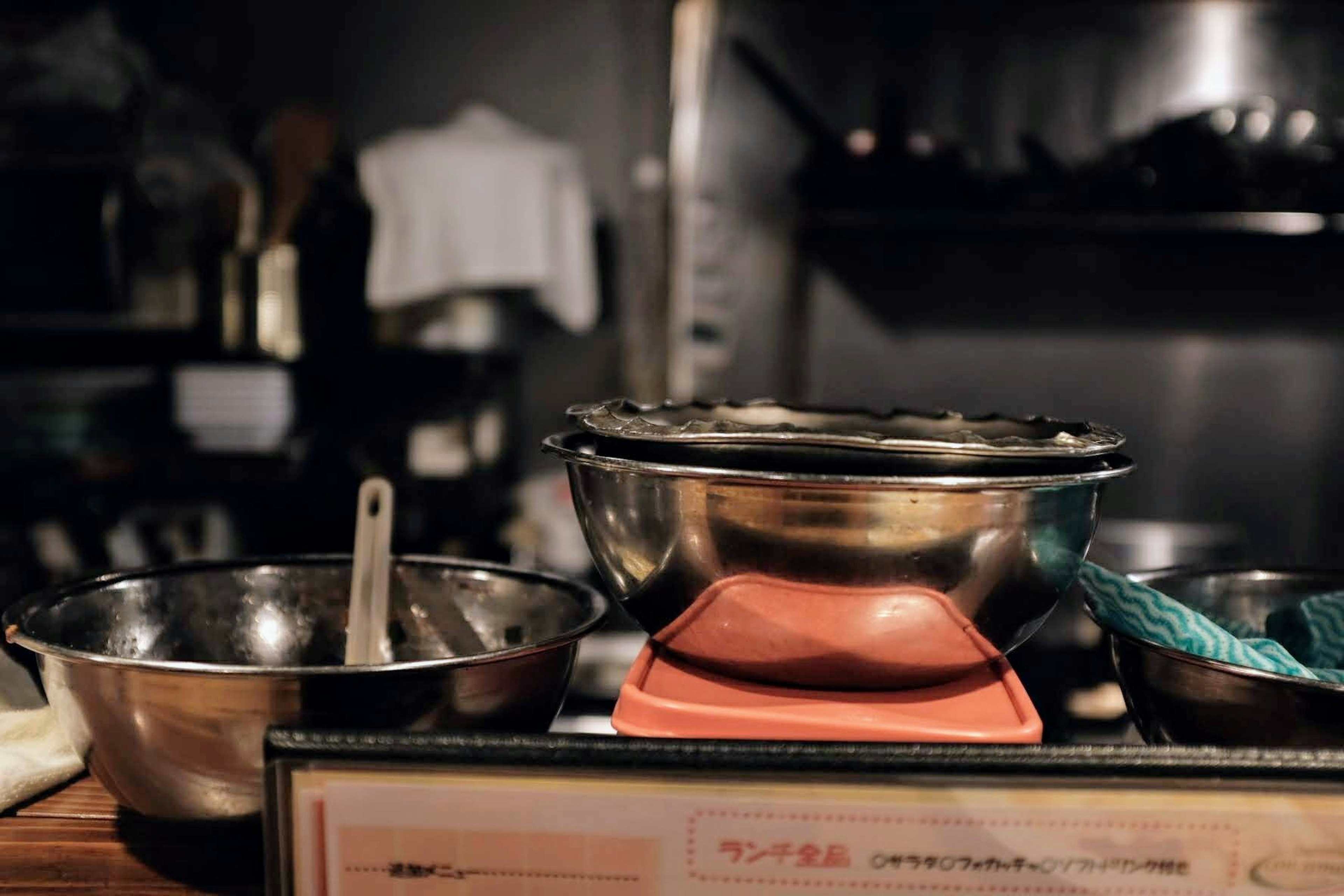 Image of kitchen bowls and pots arranged on a counter