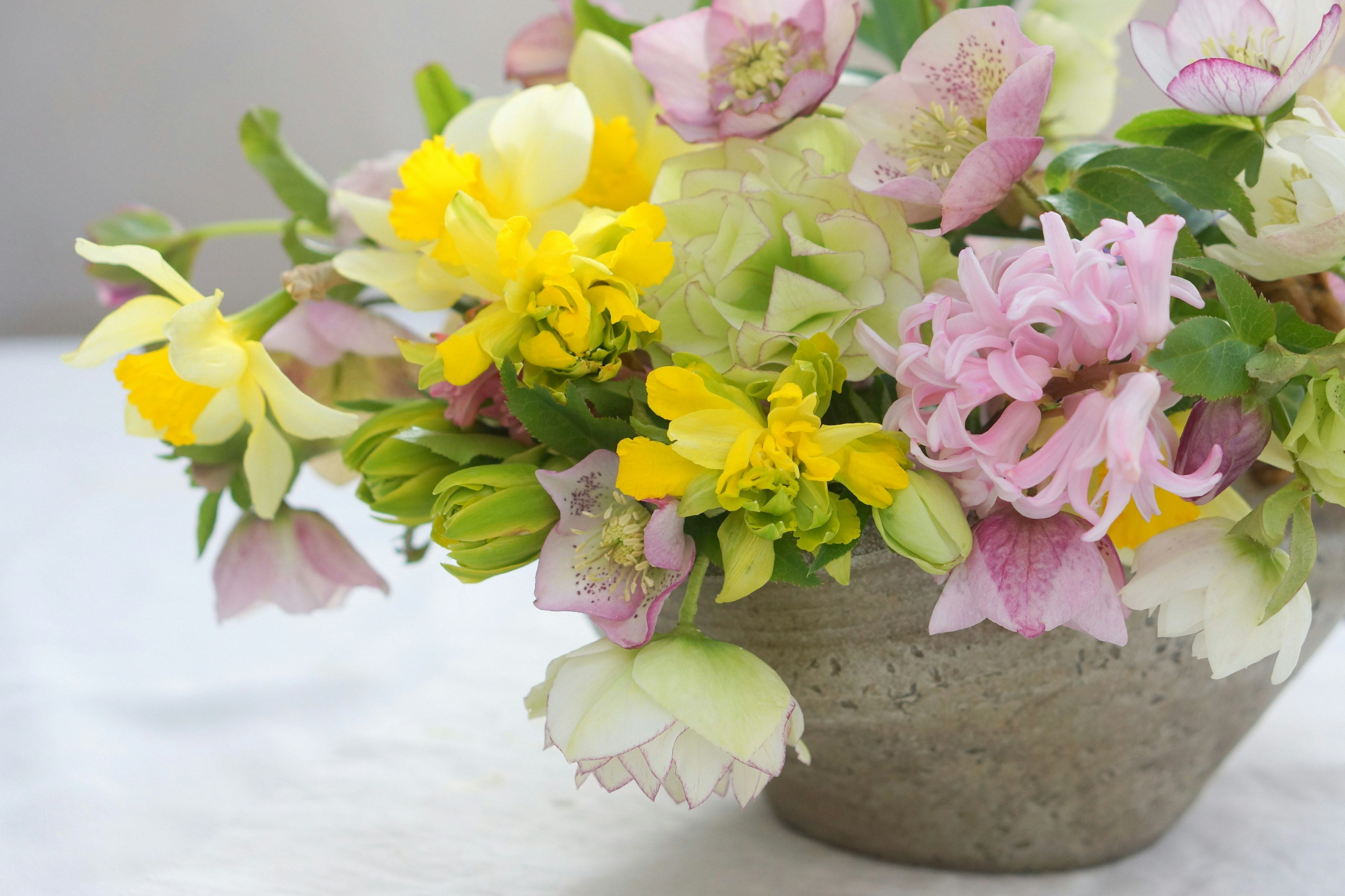 Colorful arrangement of flowers in a decorative vase