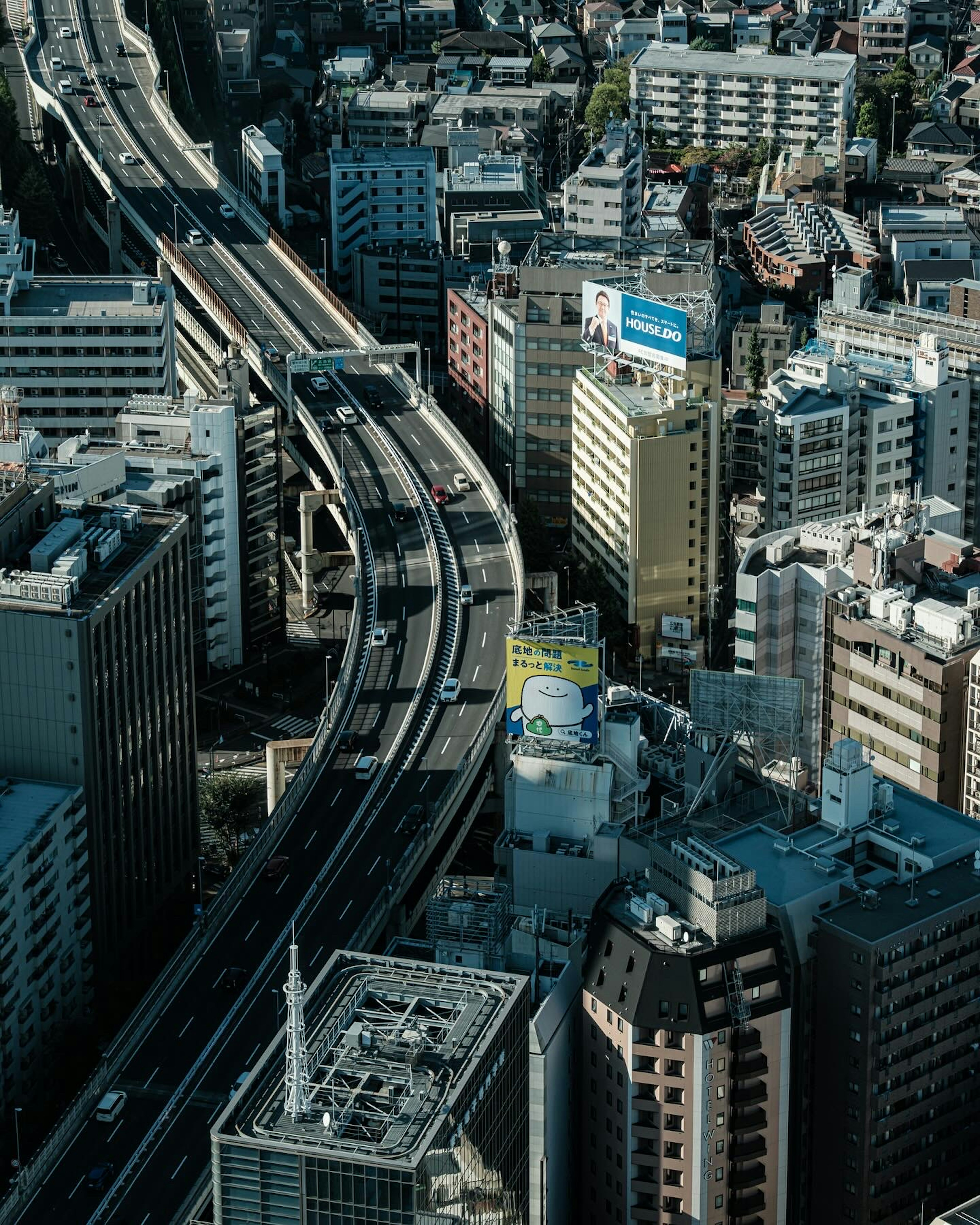 Aerial city view featuring skyscrapers and intersecting roads