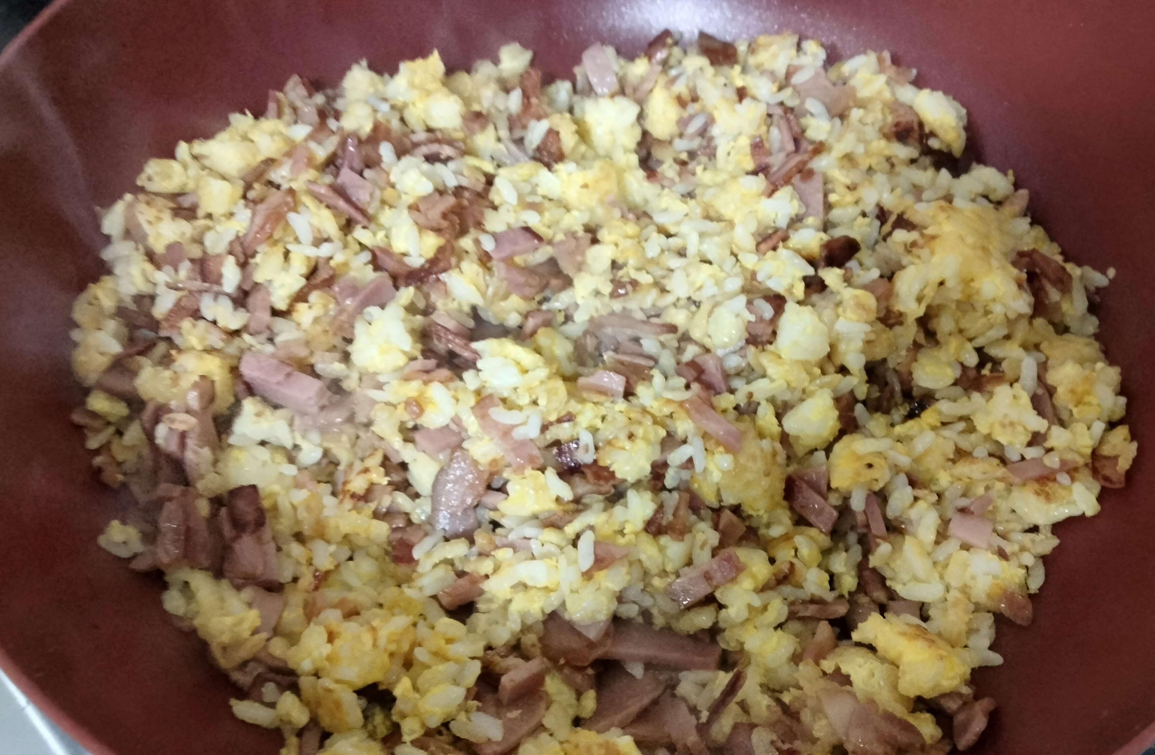 Mixed rice dish served in a brown bowl