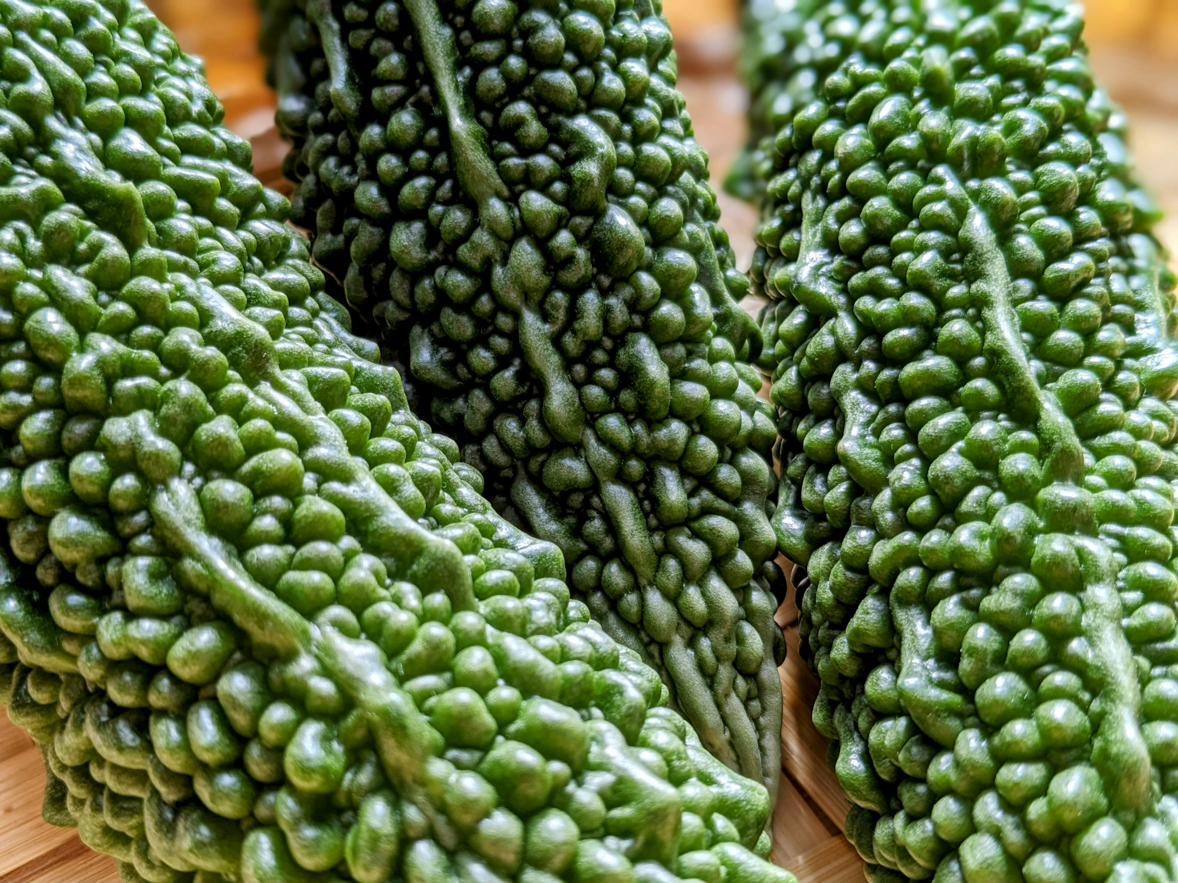 Close-up of green bitter melons arranged together