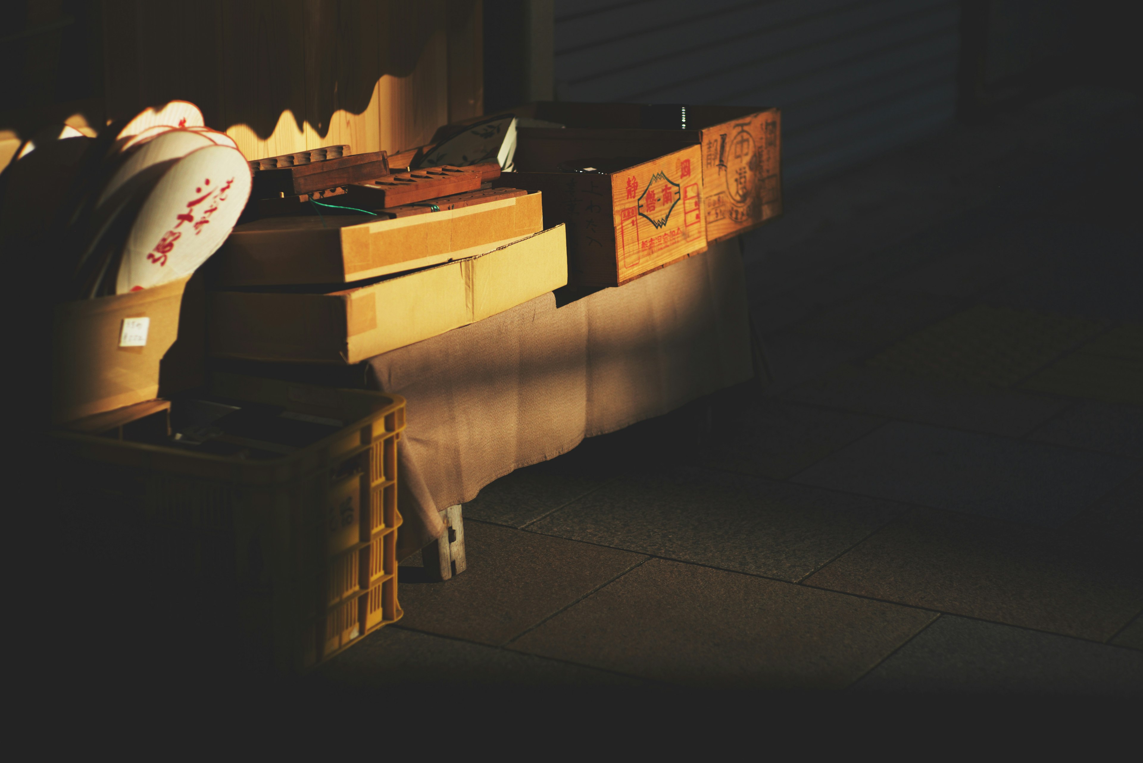 Collection of wooden boxes and items on a dark background