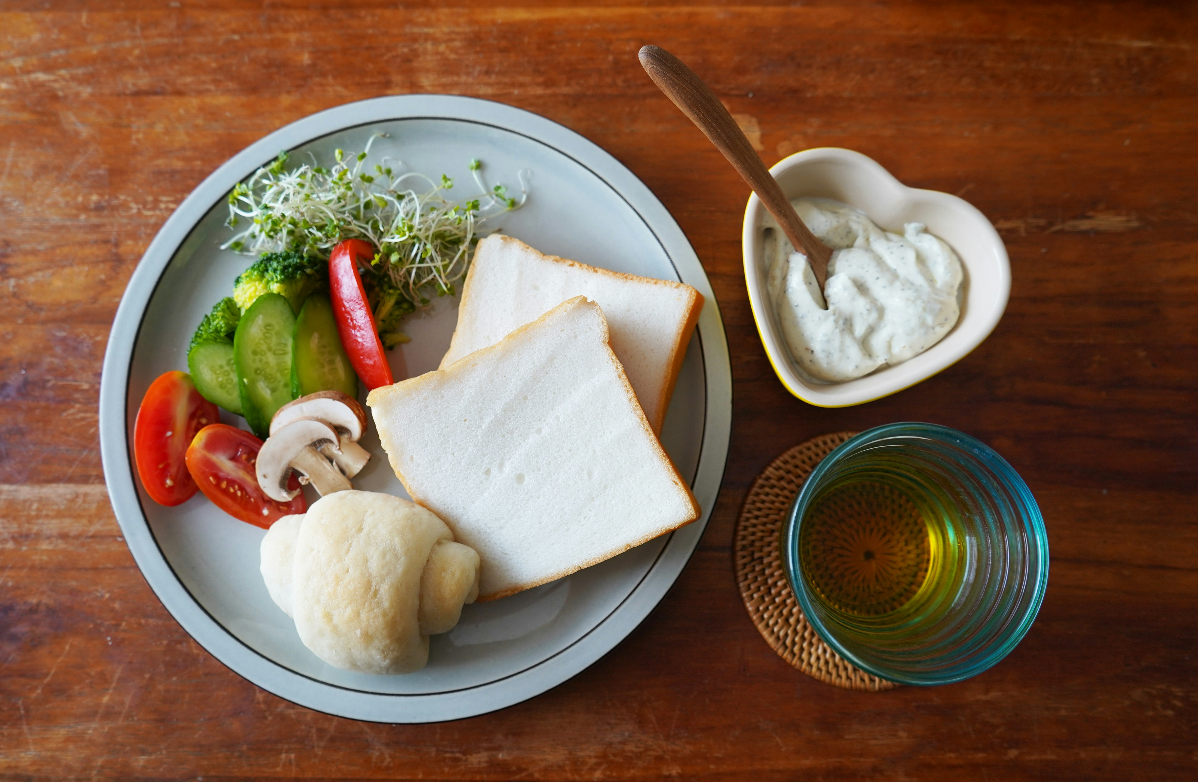 Breakfast plate featuring fresh vegetables and sliced bread