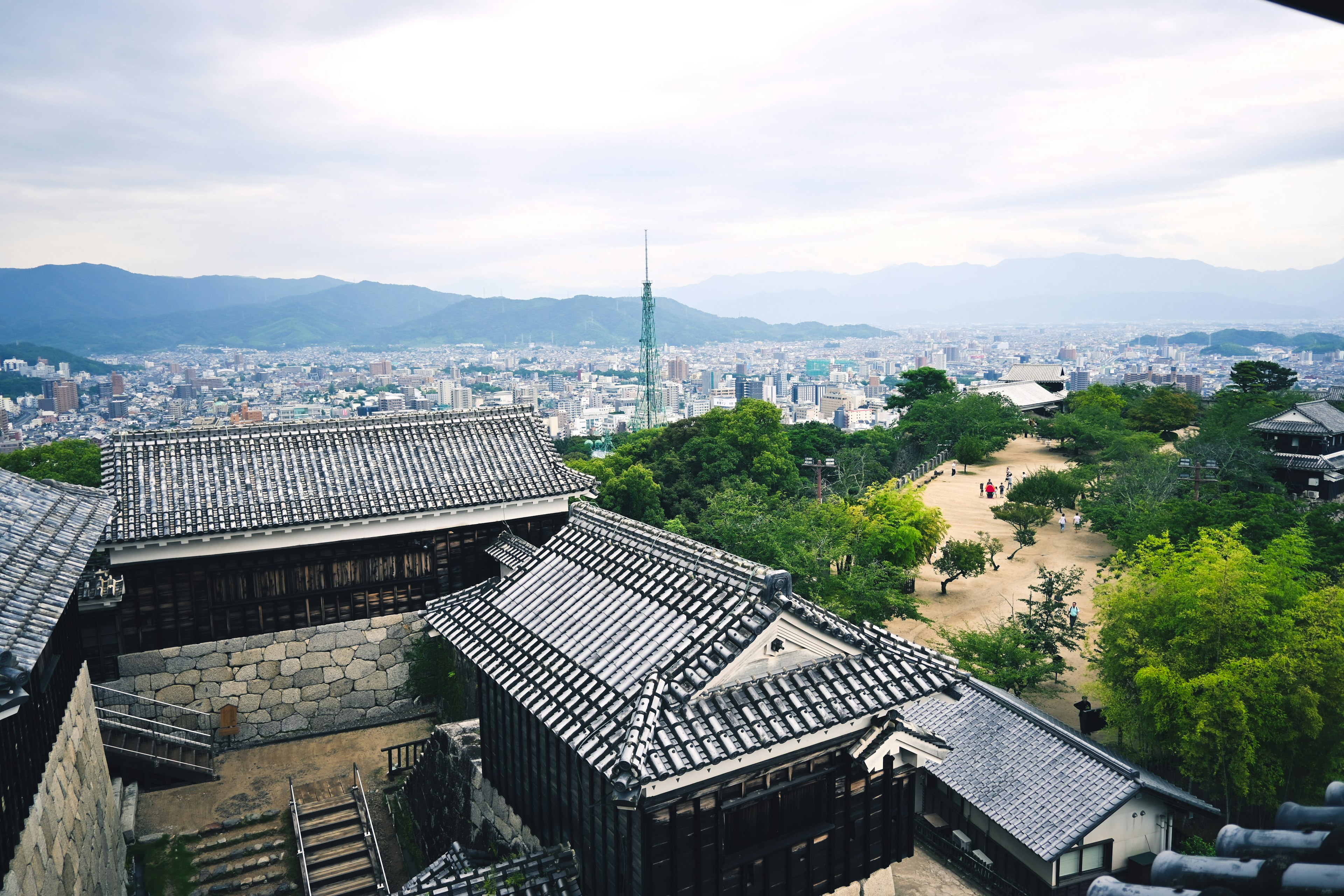 View of traditional castle rooftops and city landscape