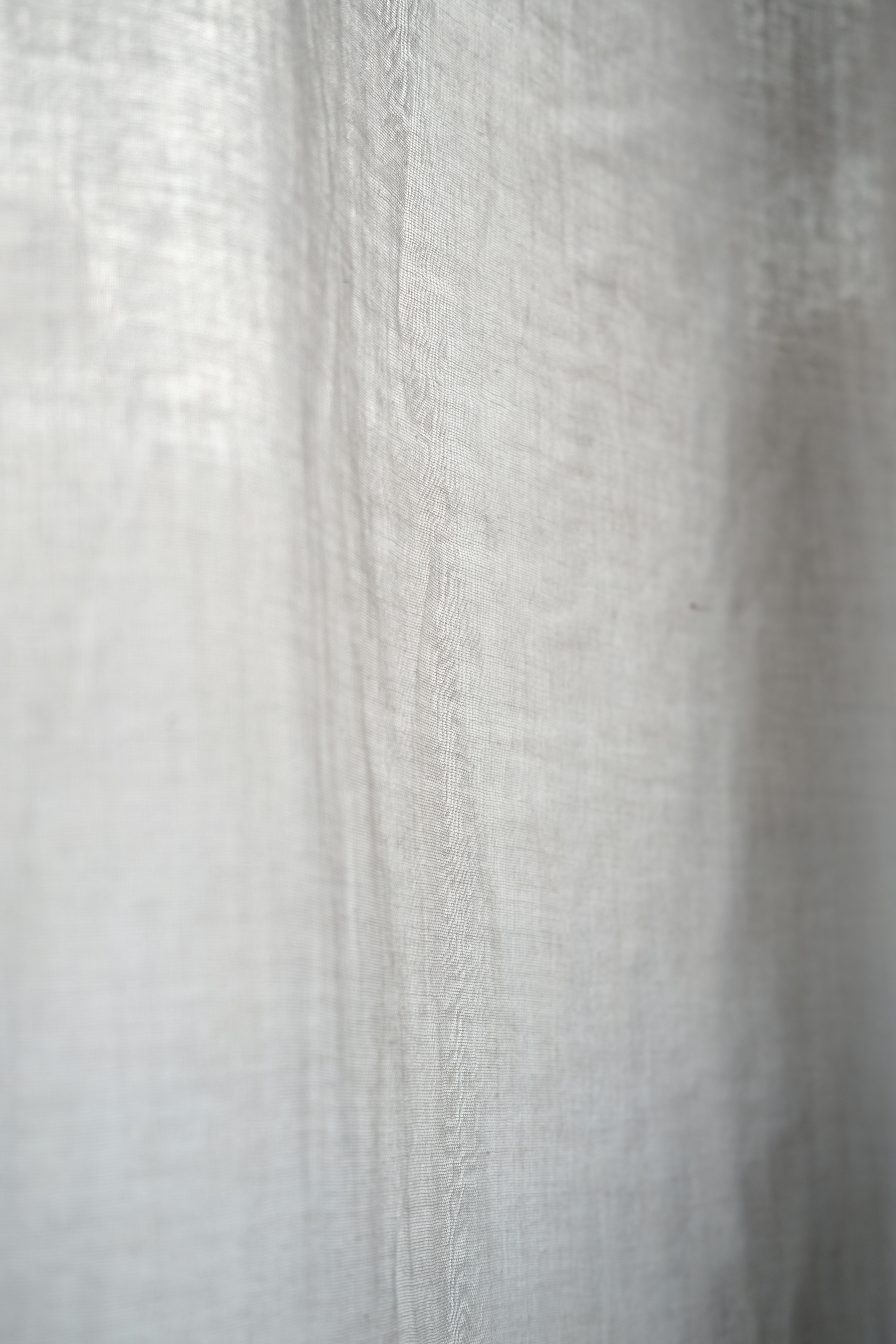 Close-up of a light white curtain texture