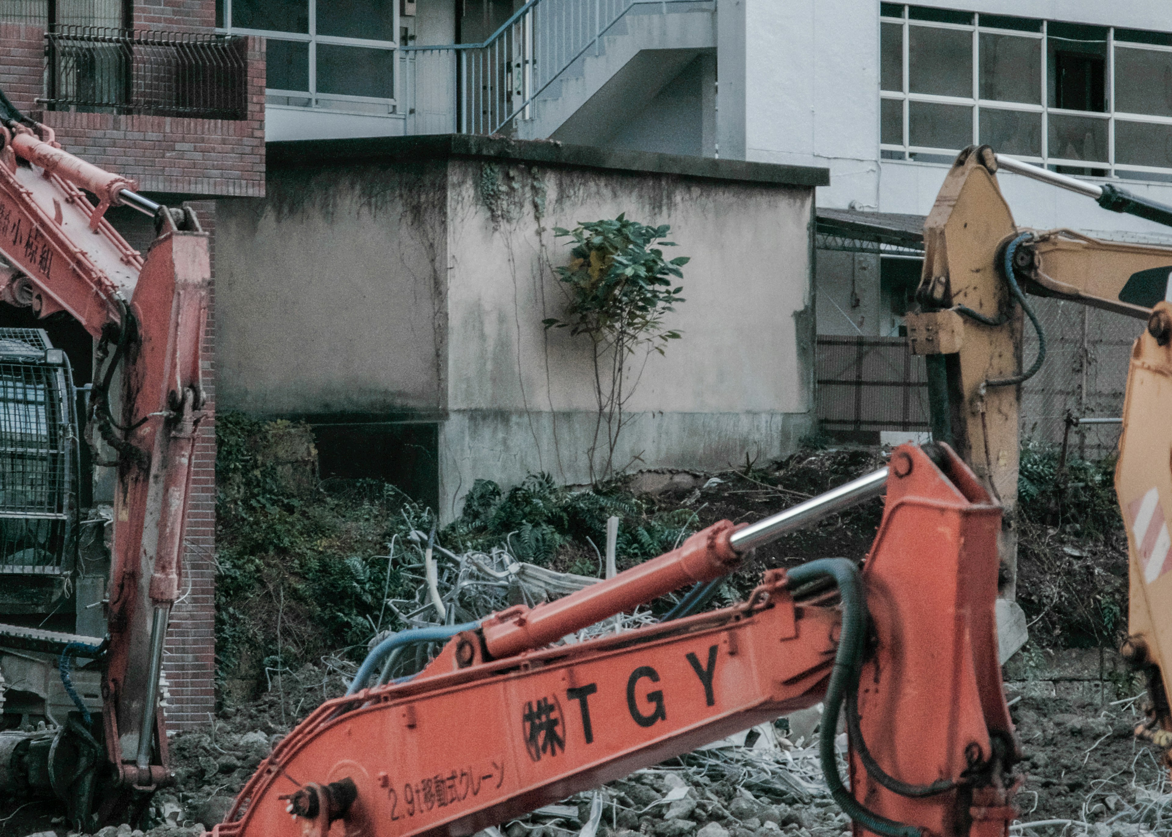 Construction site featuring excavators and debris