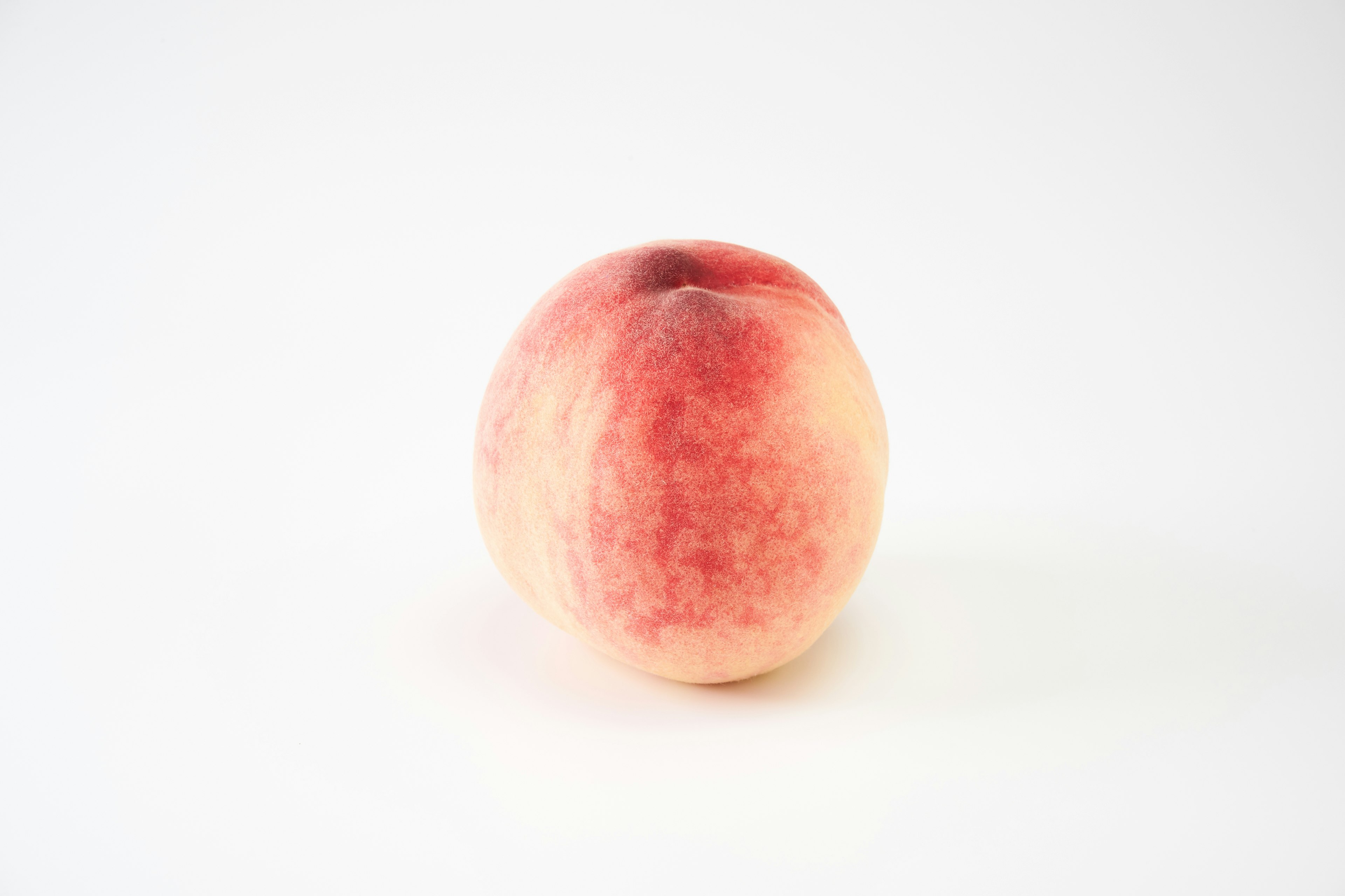 Peach fruit on a white background