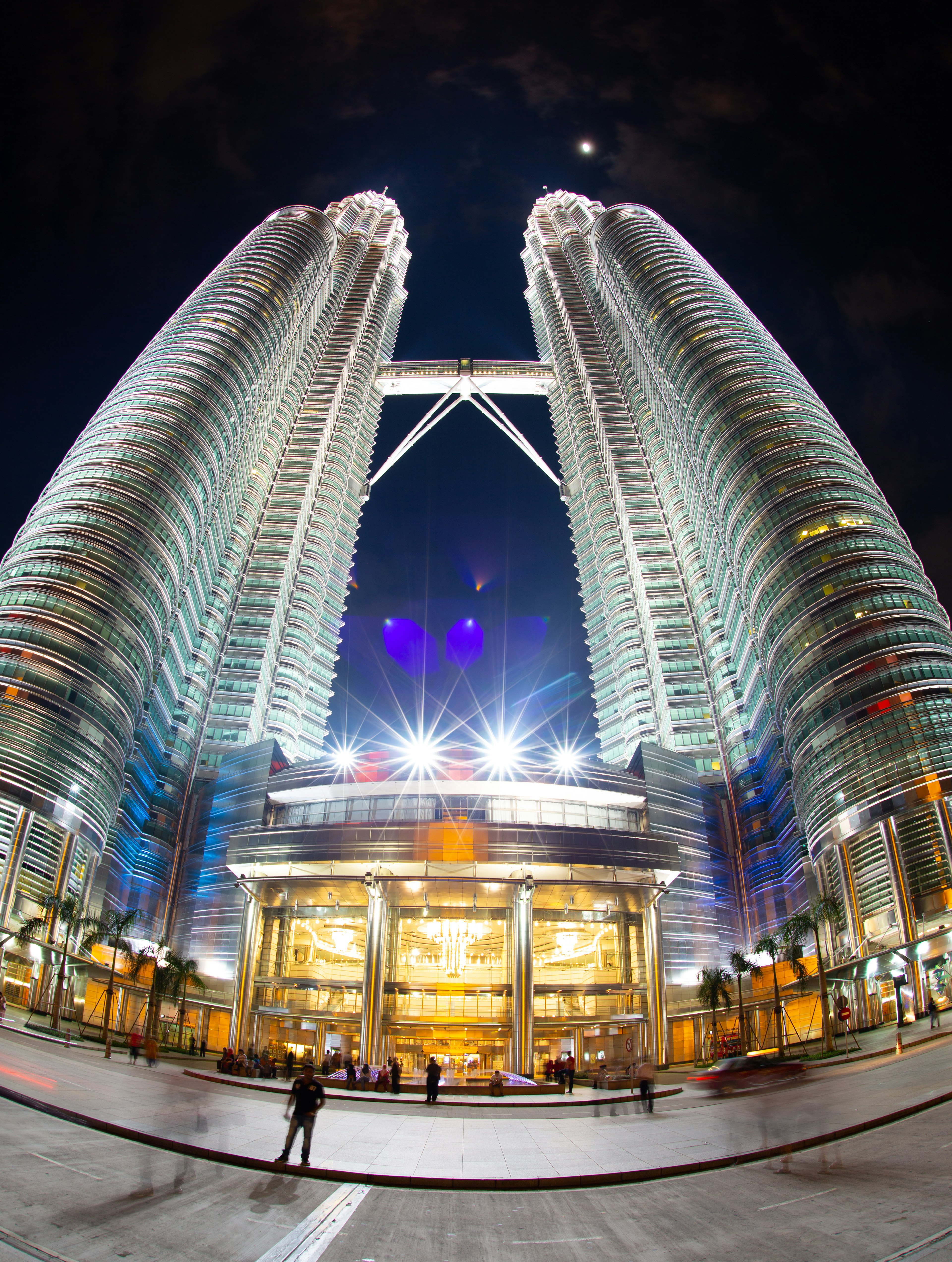 Petronas Twin Towers at night showcasing stunning architecture and bright lights