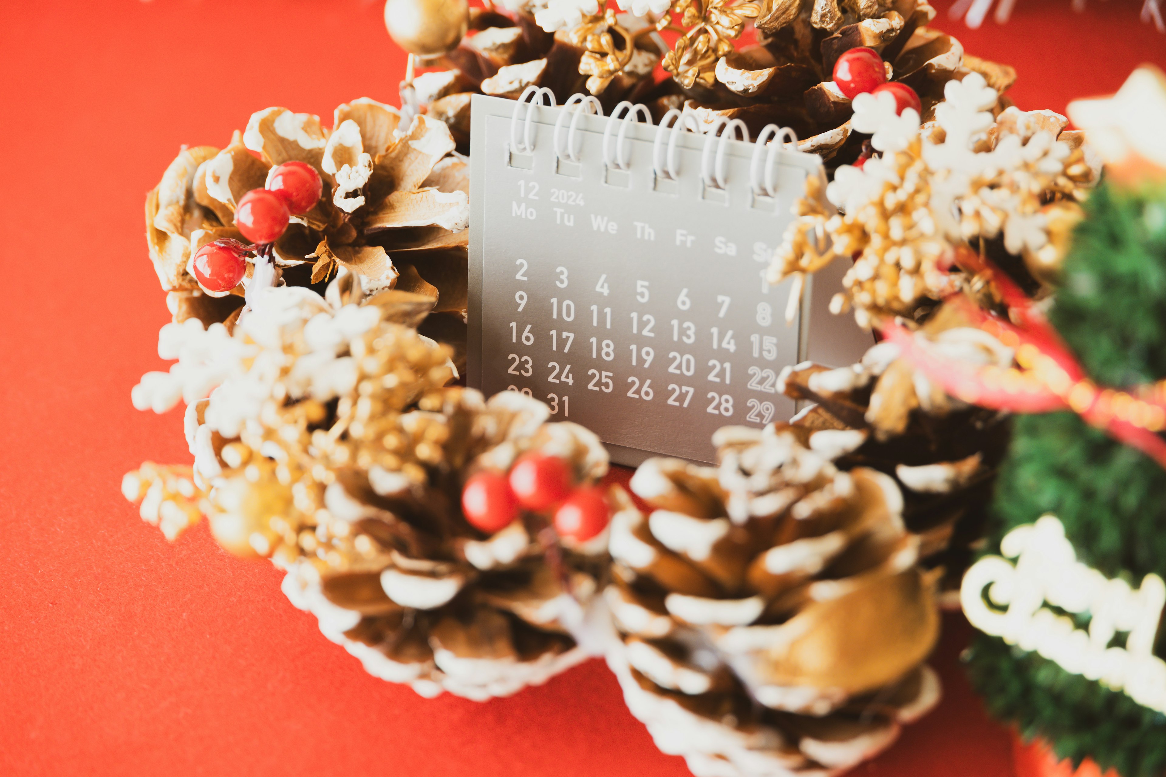 Christmas wreath with a calendar and pine cone decorations