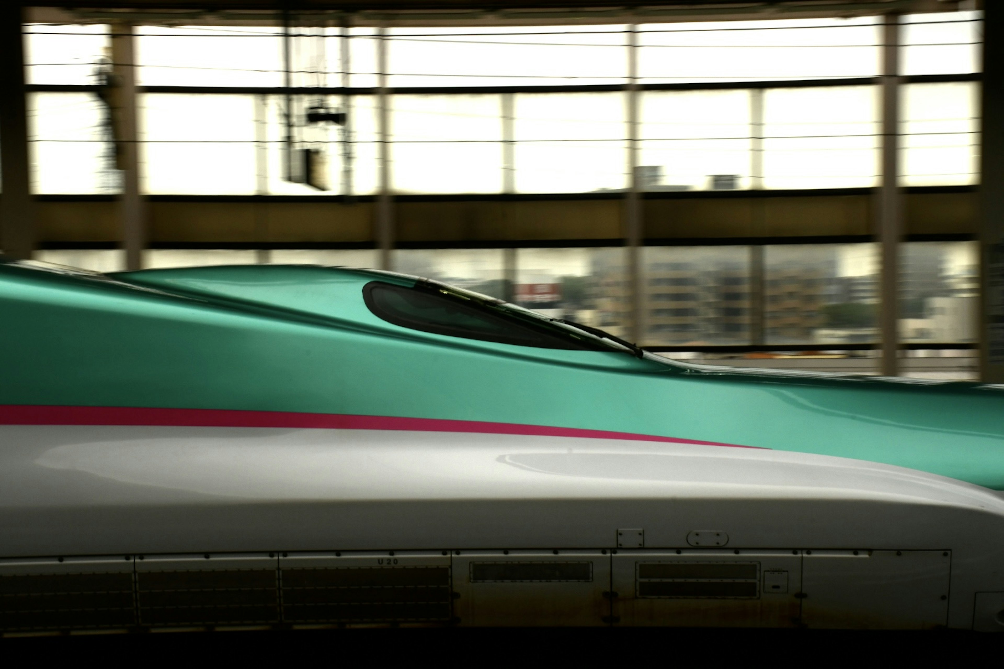 Shinkansen's streamlined design with distinctive green exterior