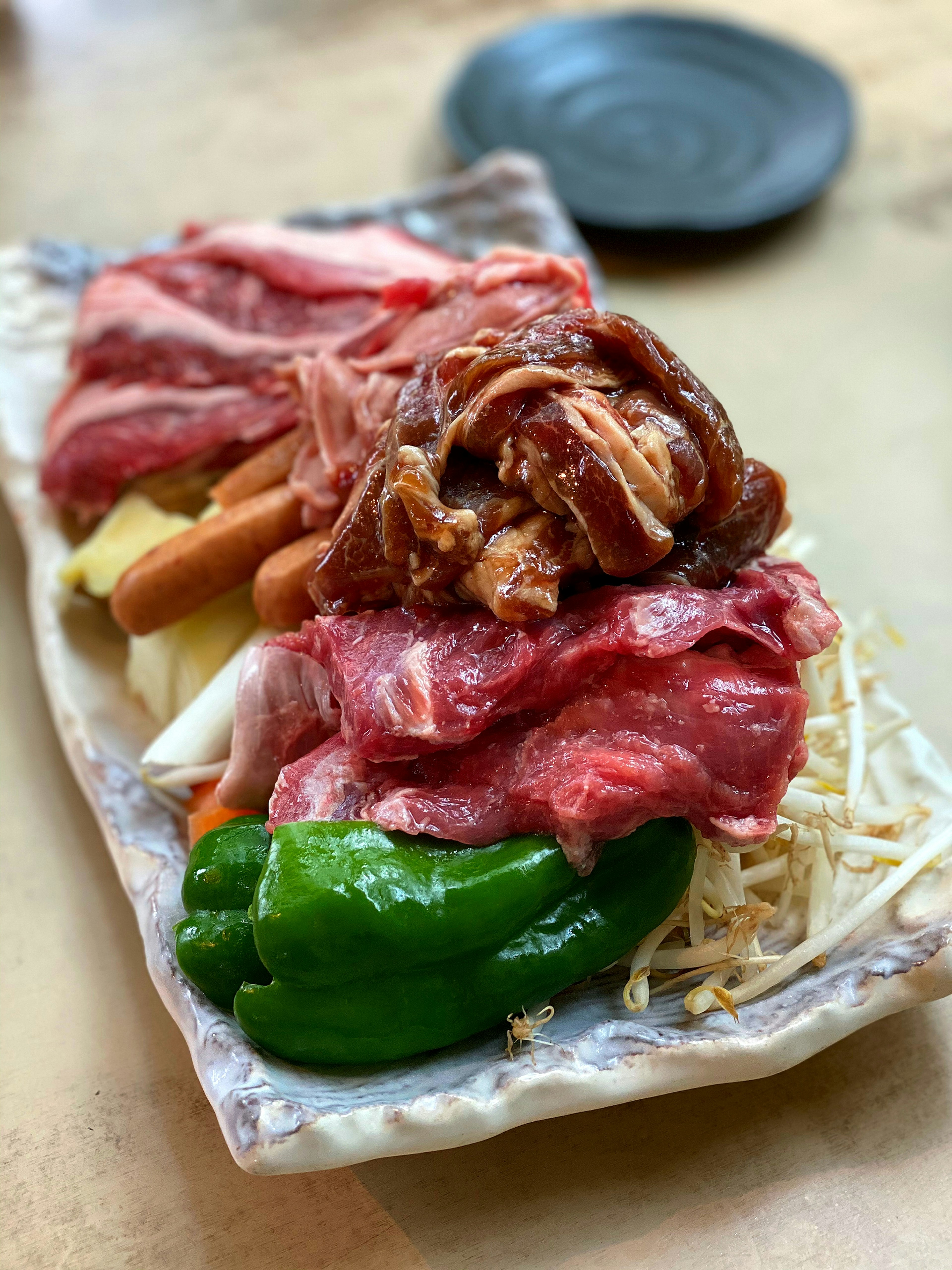 Plate of assorted meats and vegetables arranged attractively