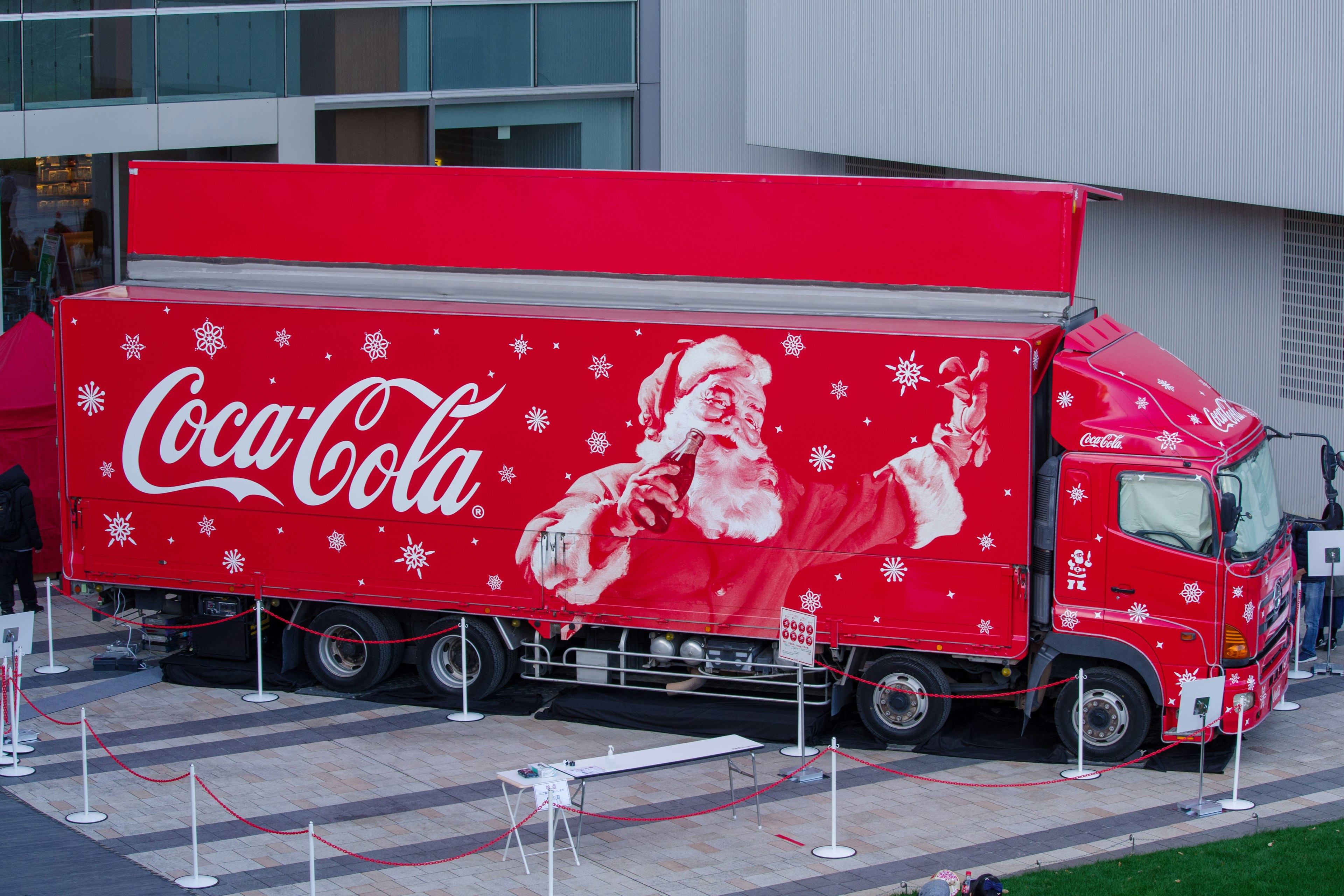 Coca-Cola truck featuring Santa Claus design in festive red