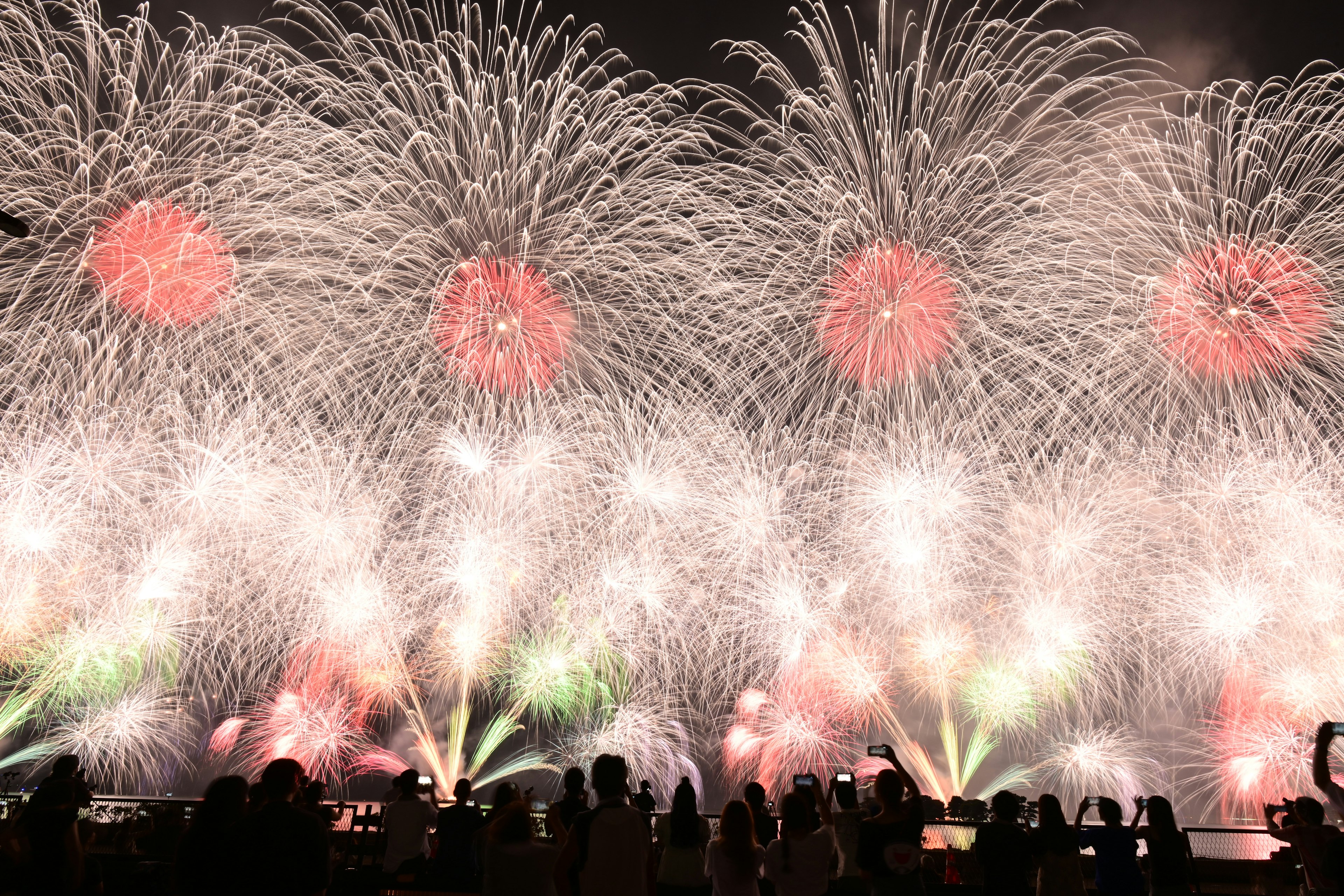 Colorful fireworks display lighting up the night sky with vibrant bursts