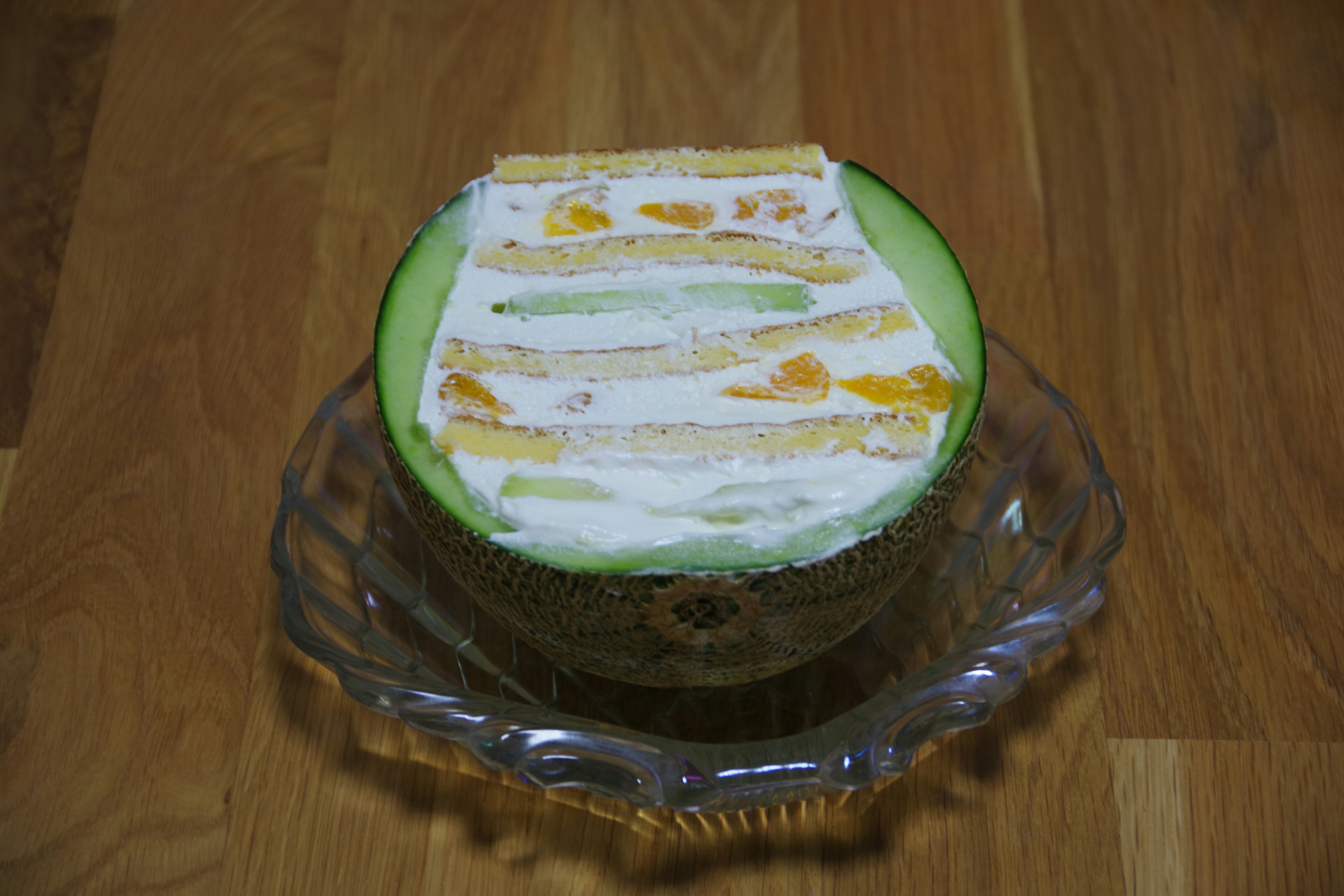 Colorful fruit dessert served in a melon bowl