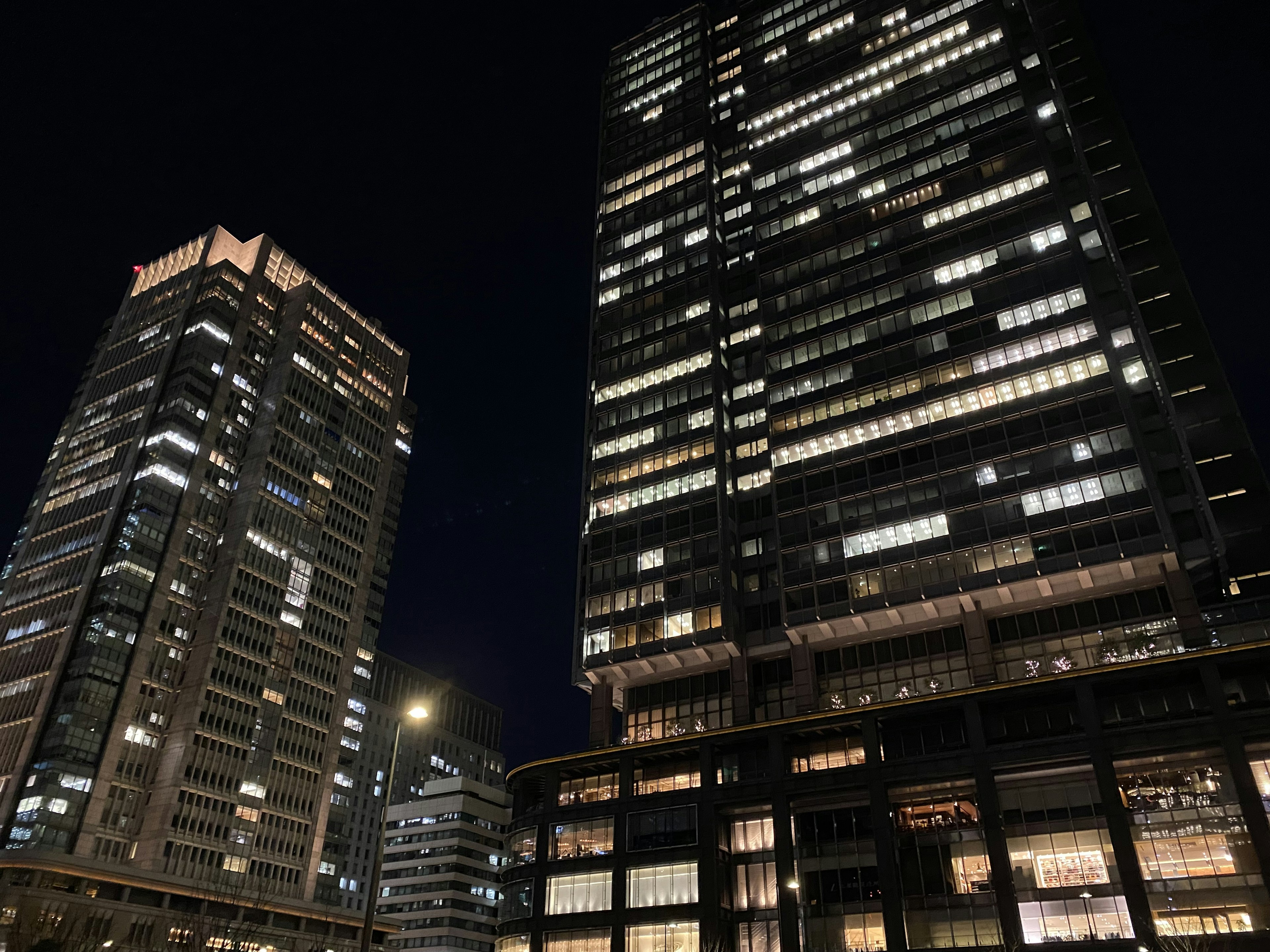 Night view of illuminated skyscrapers showcasing modern architecture