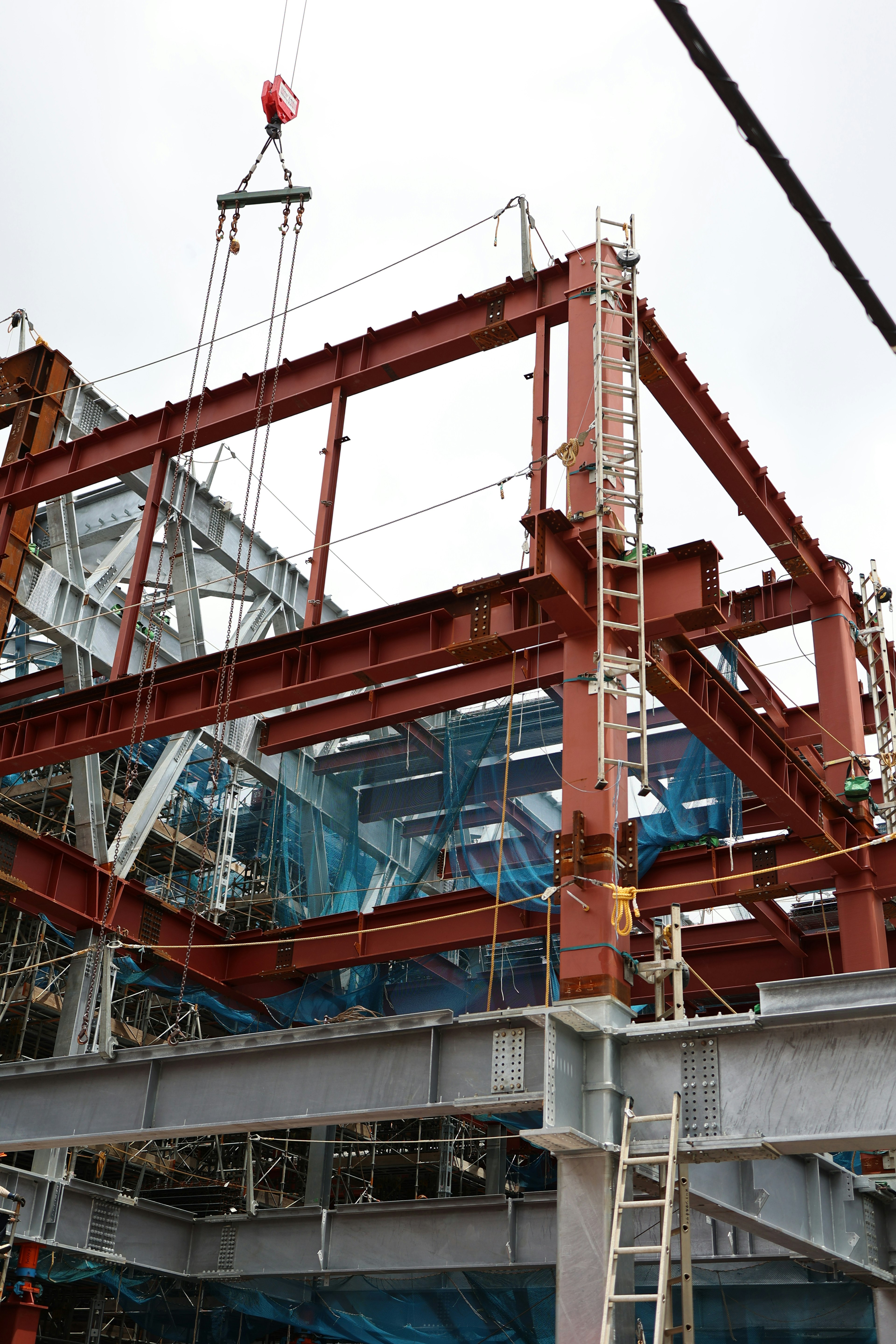 Construction site with steel structure and crane operation