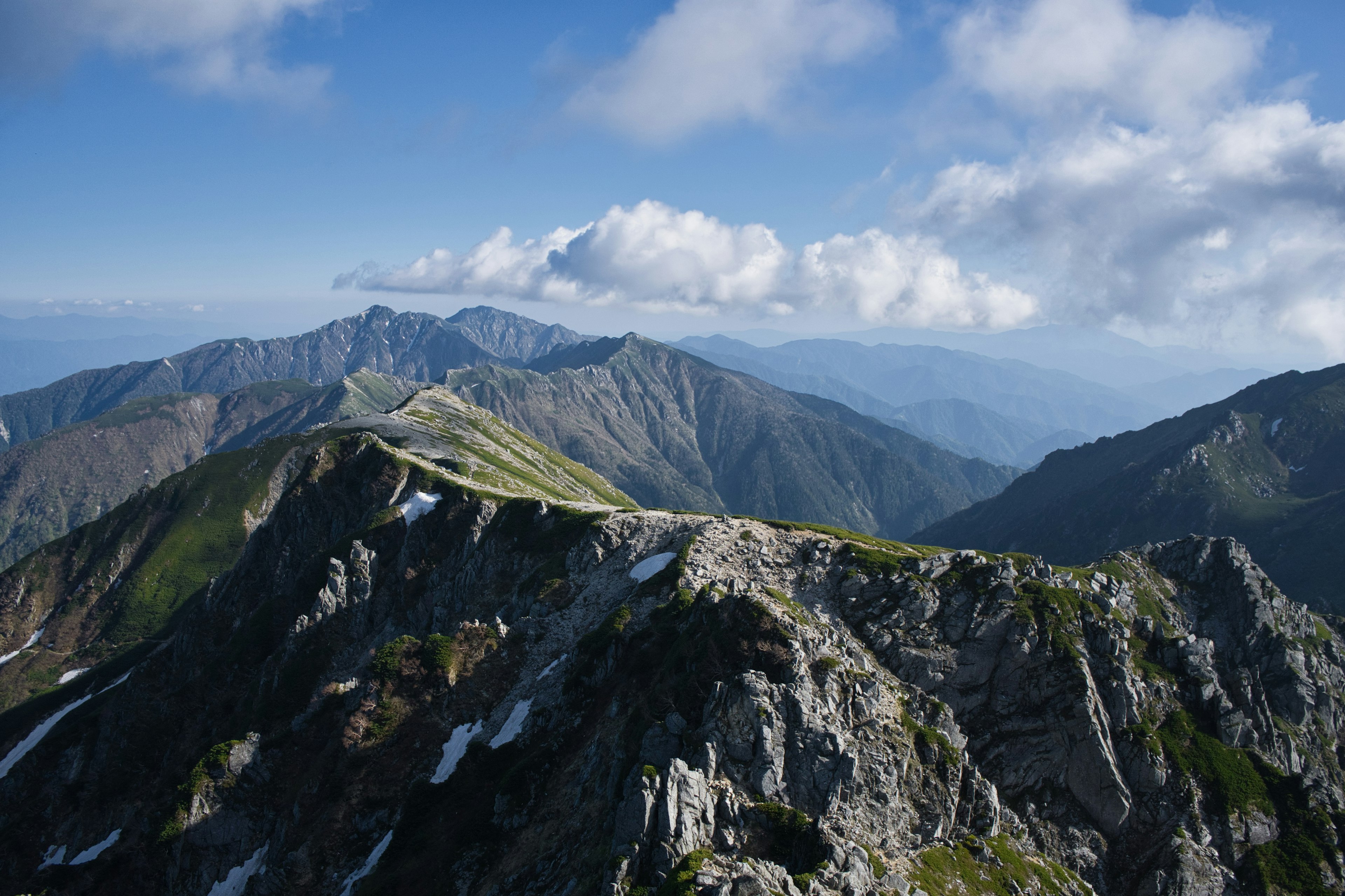 Scenic mountain landscape with peaks and blue sky