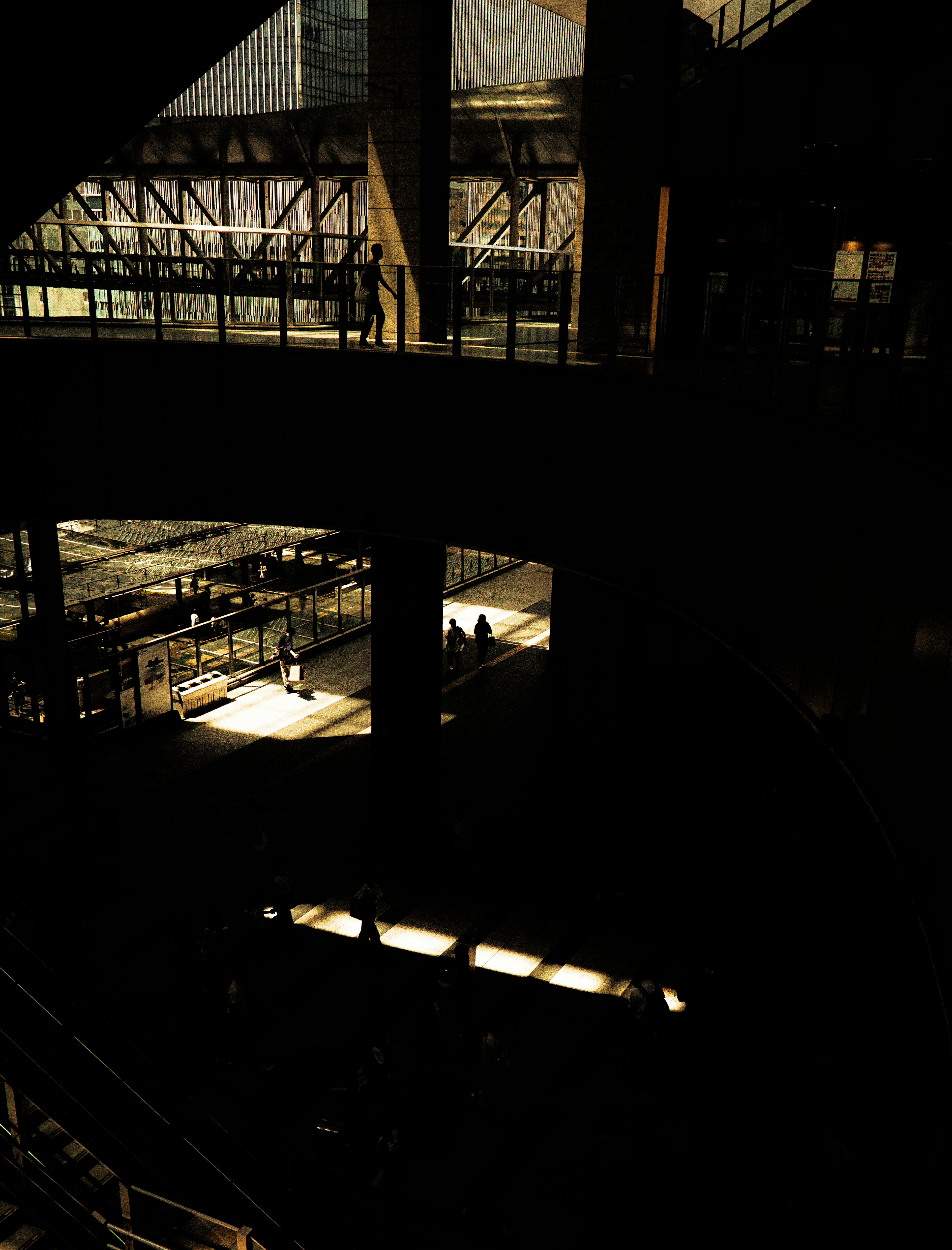 Industrial interior with shafts of light in a dark space