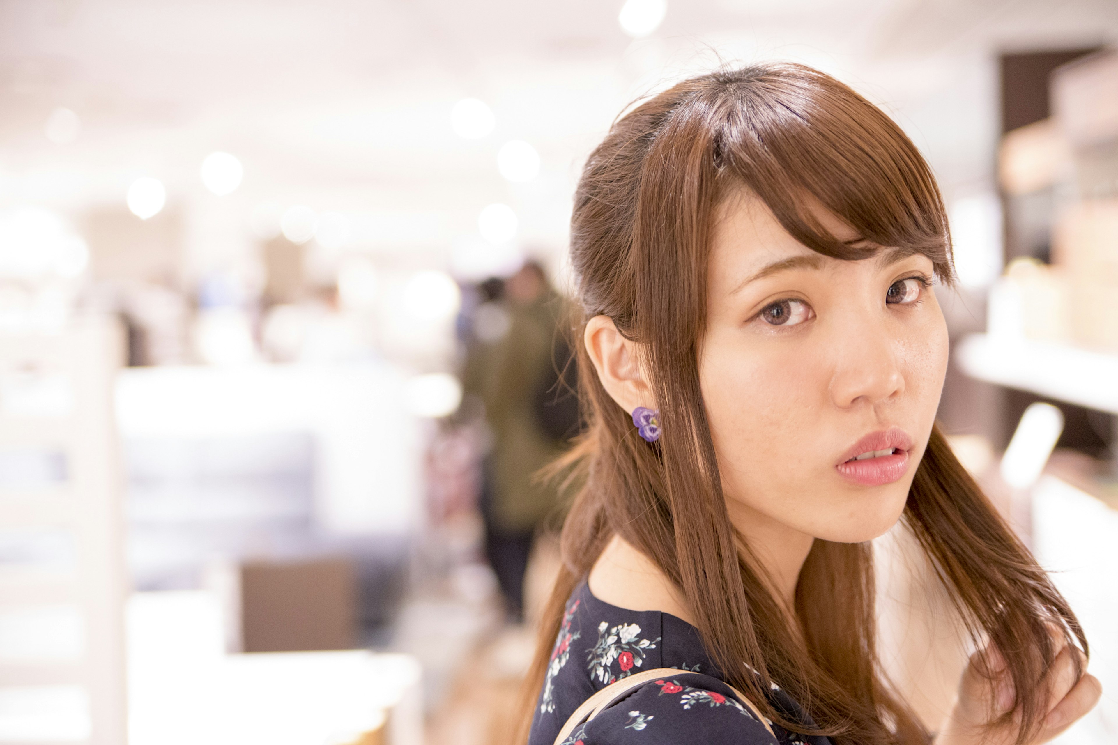 A woman looking back in a store setting