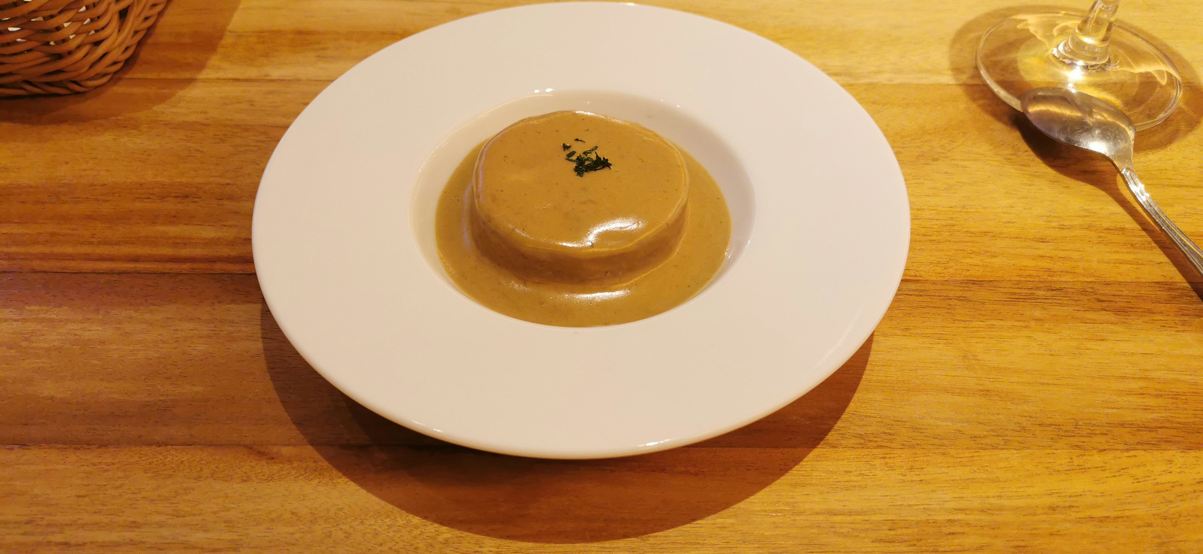 Creamy custard pudding served on a white plate