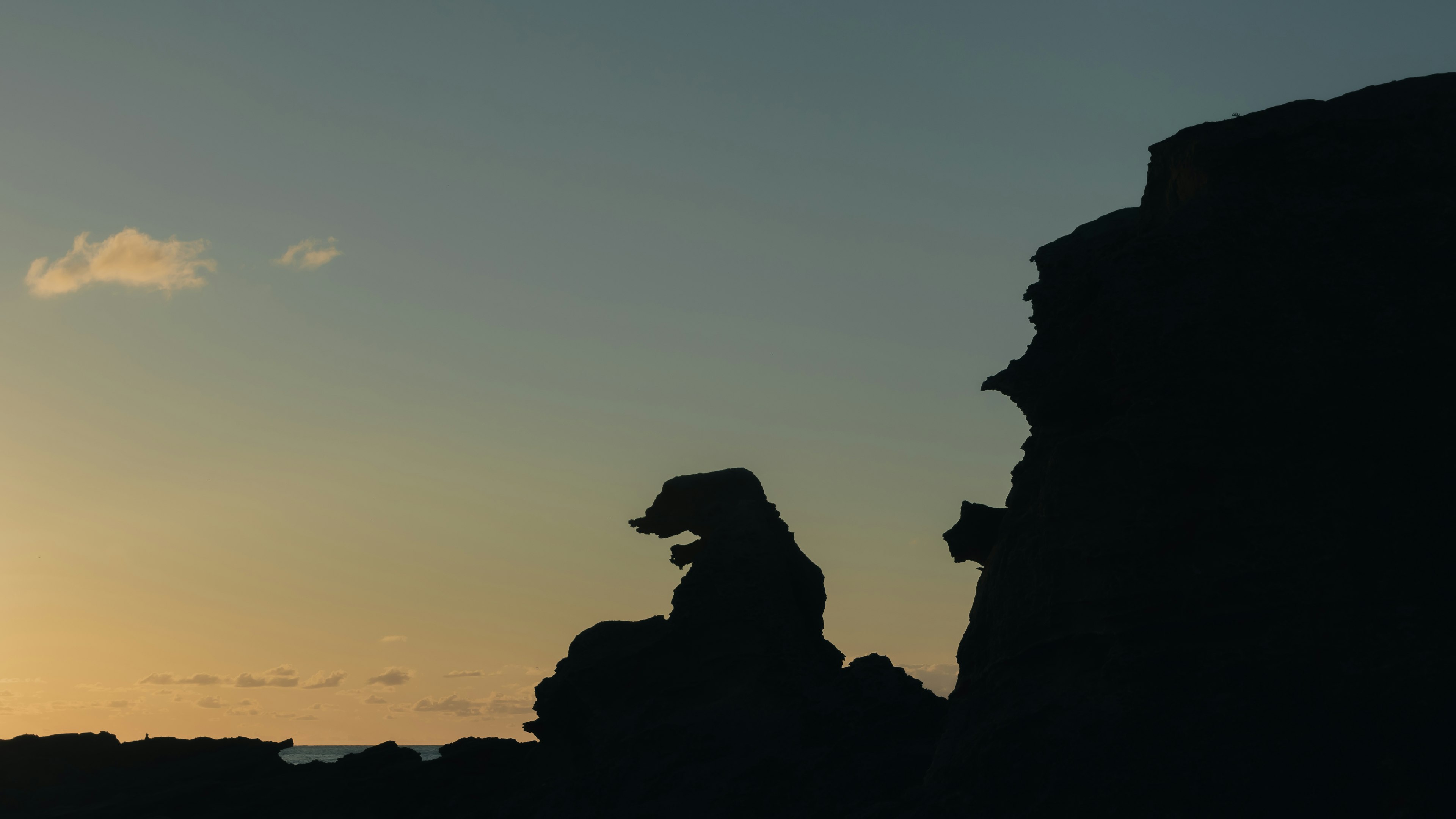 Silhouette of rocks during sunset with gradient sky