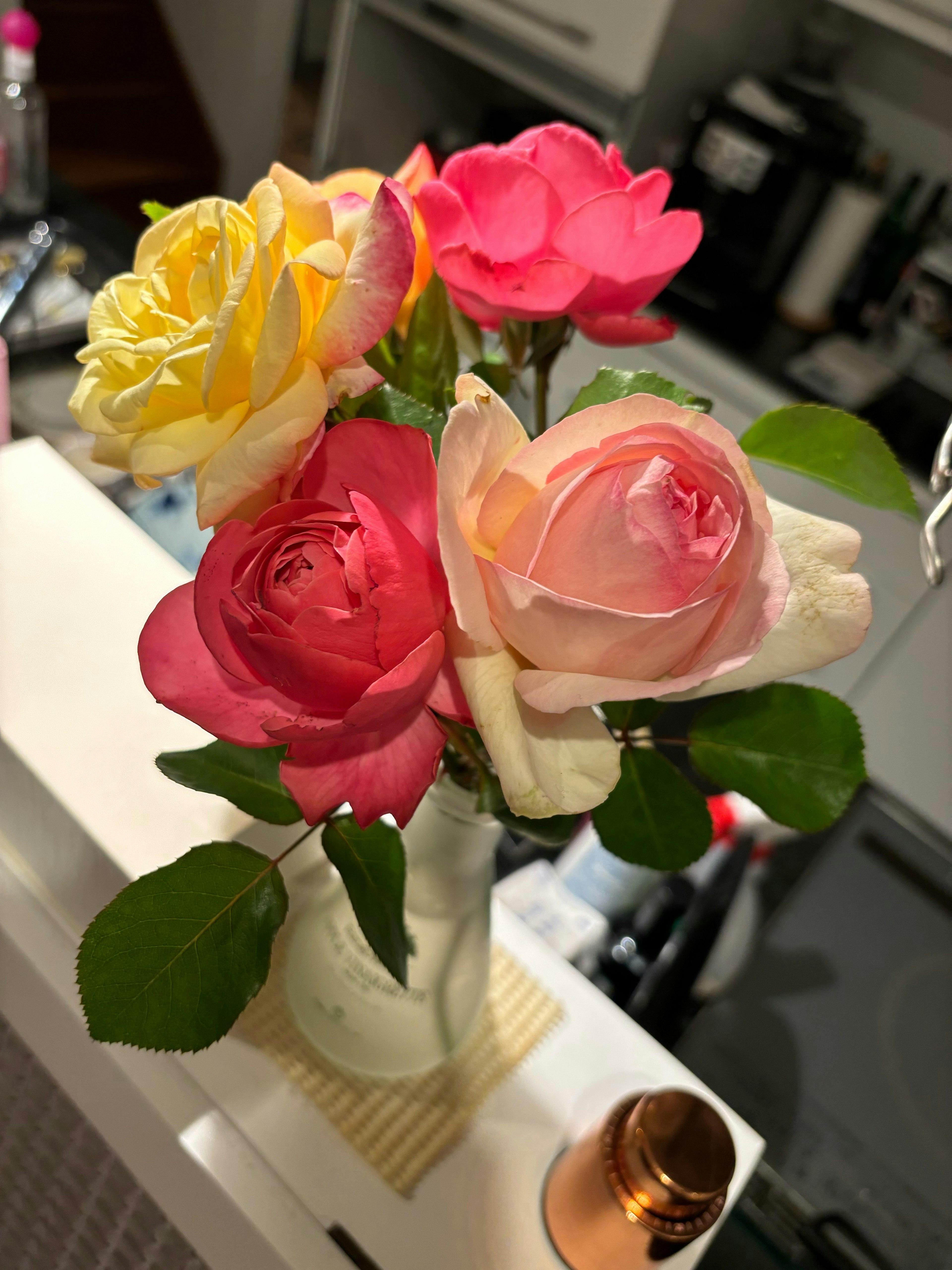 Beautiful arrangement of colorful roses in a vase