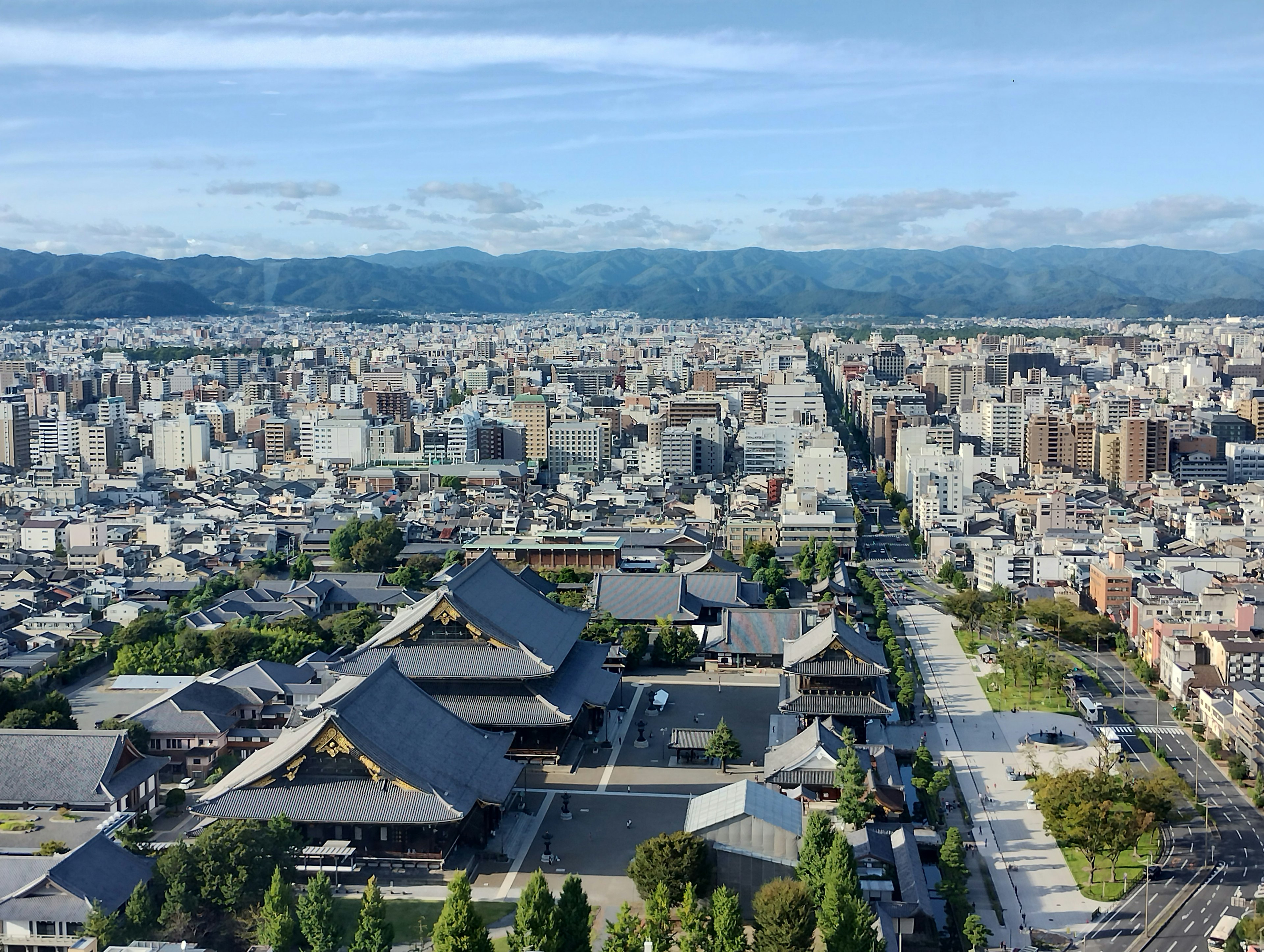 Aerial view of Kyoto cityscape featuring traditional temples