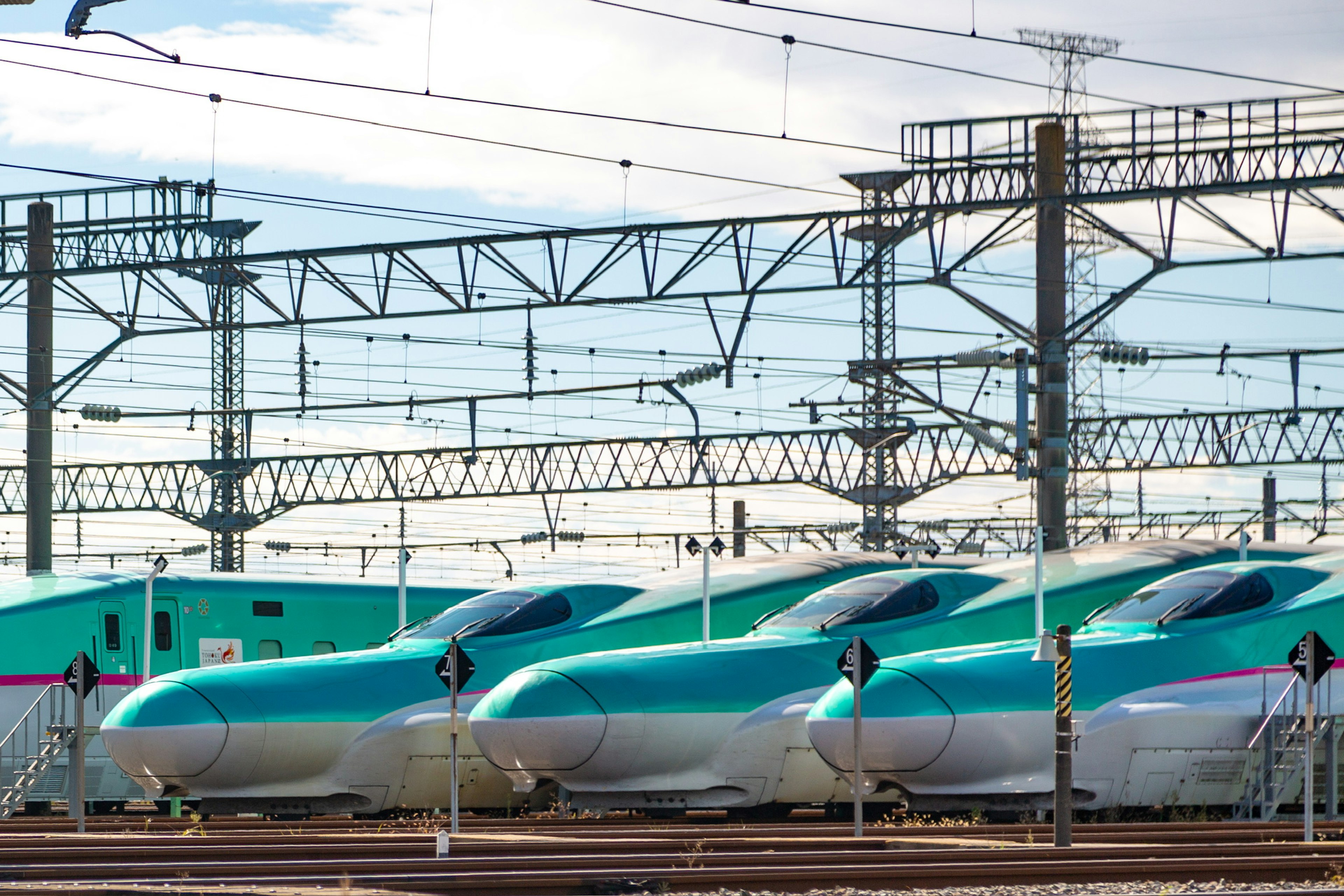 Row of Shinkansen trains in a railway yard