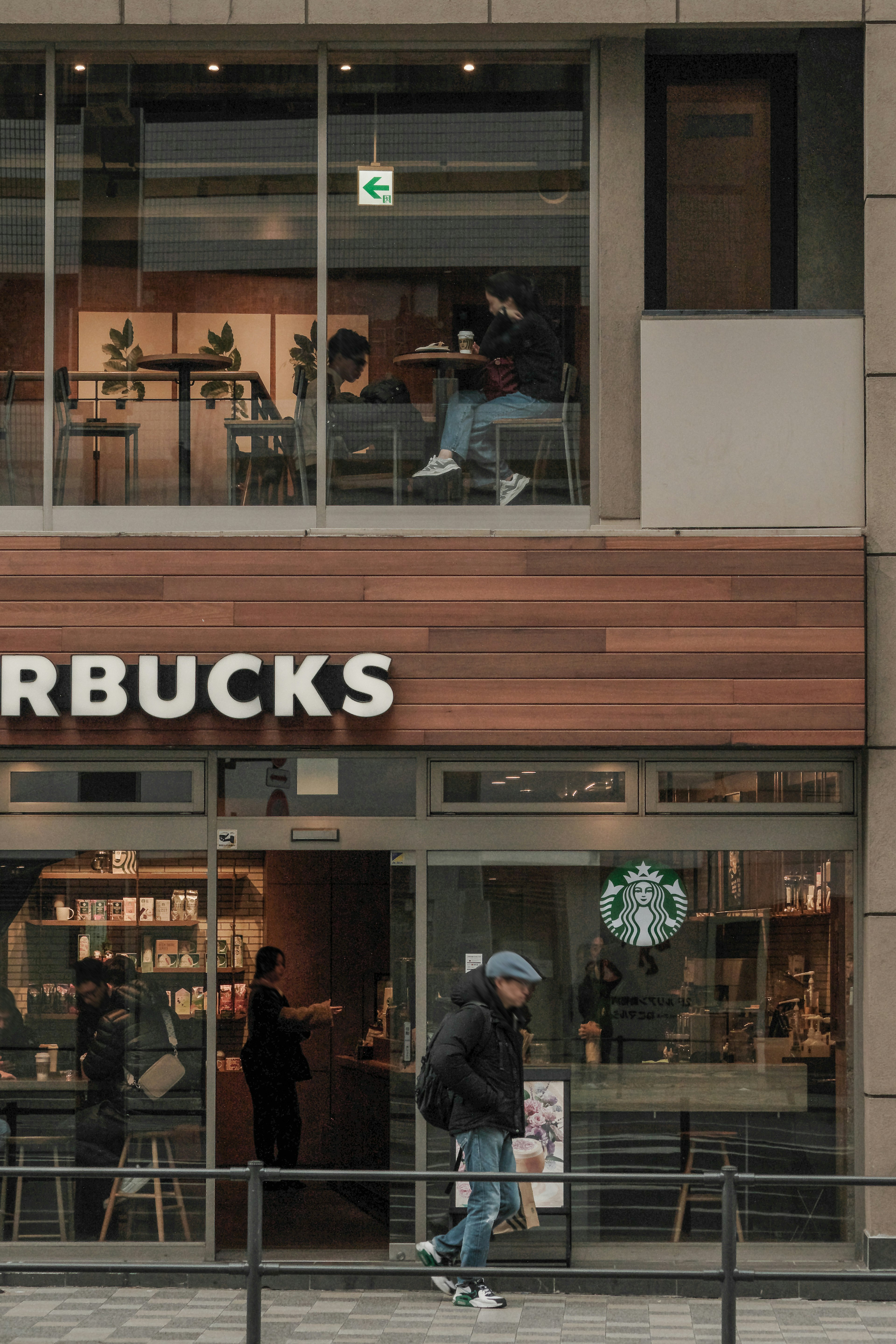 Exterior view of Starbucks with interior visible