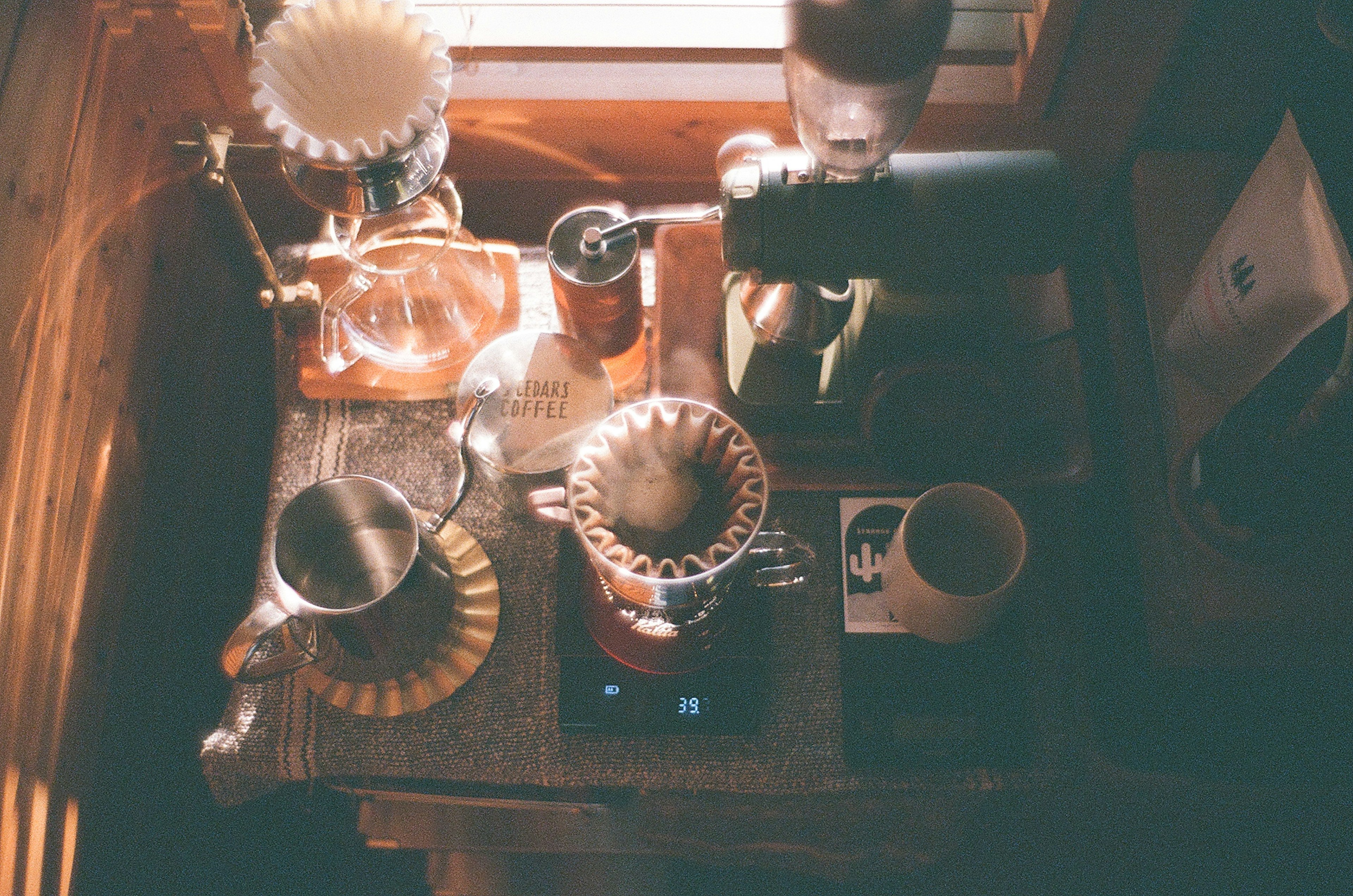 Overhead view of a coffee brewing setup with various tools