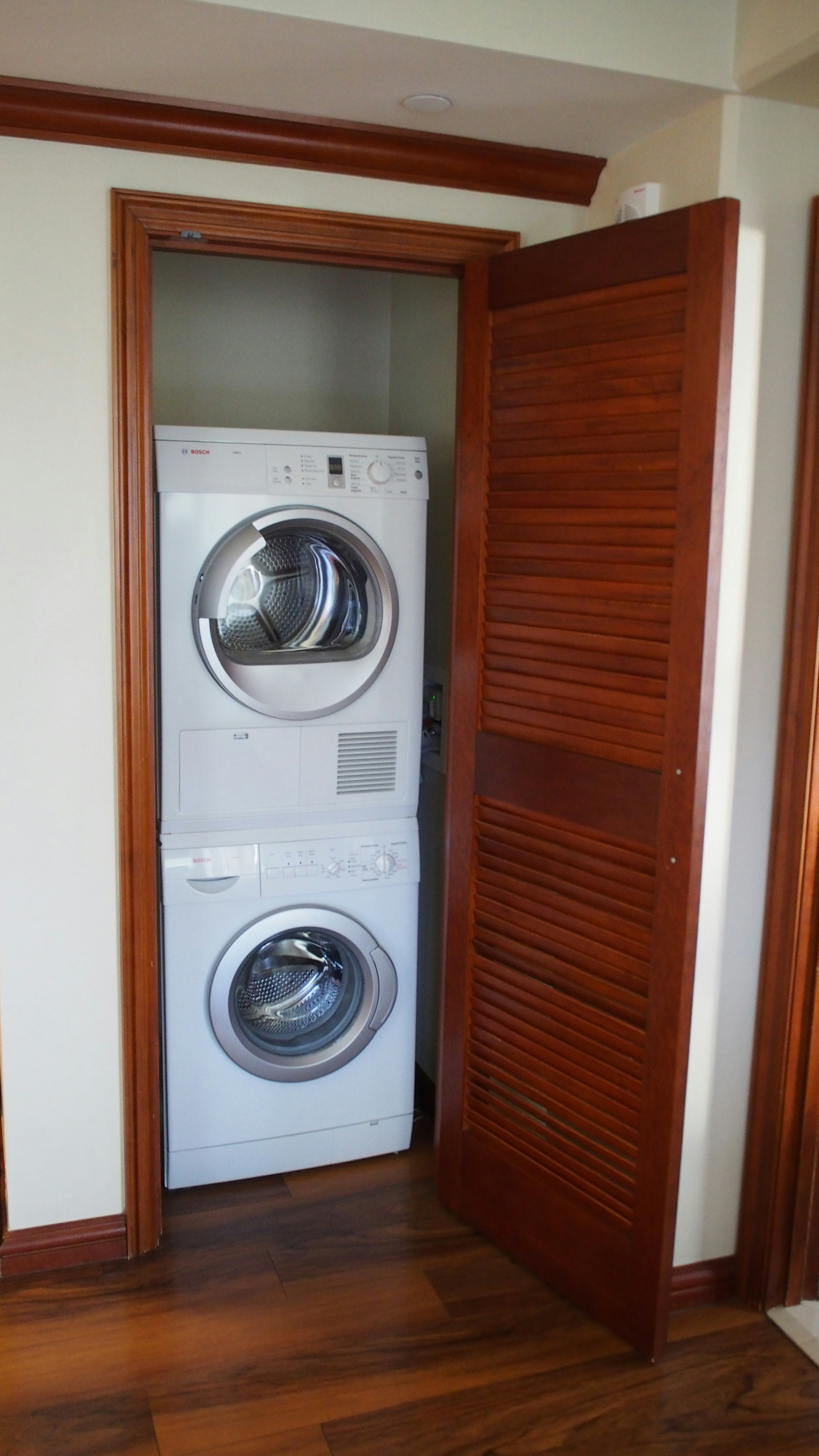 Stacked washer and dryer in a closet